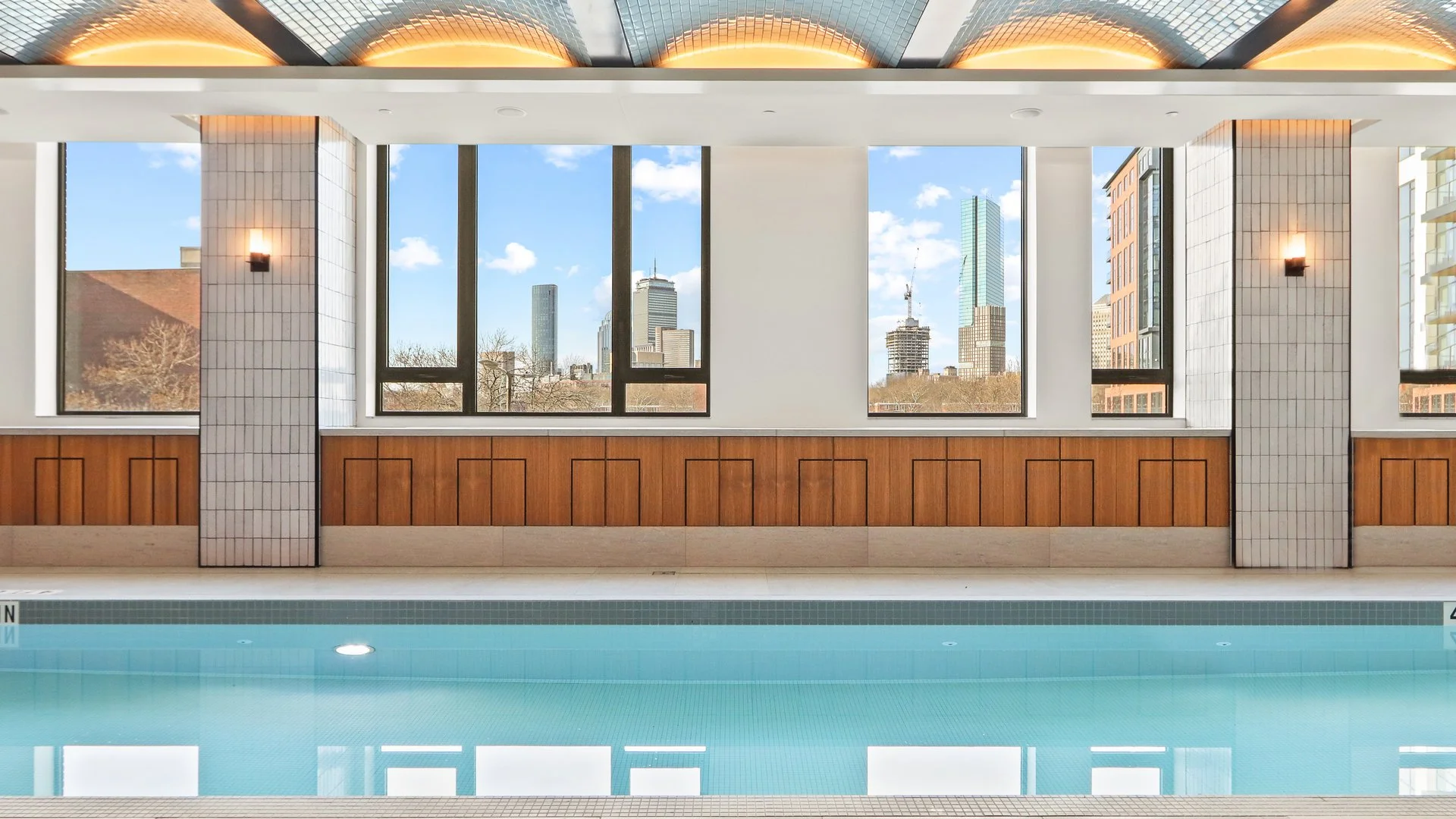 Spa-like lap pool with waterfall and sauna