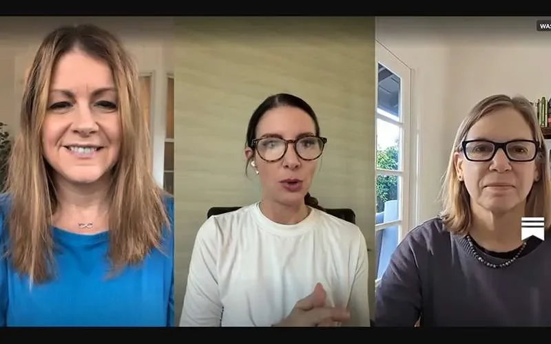 A Zoom video call with three women, each in separate home environments, engaged in conversation.