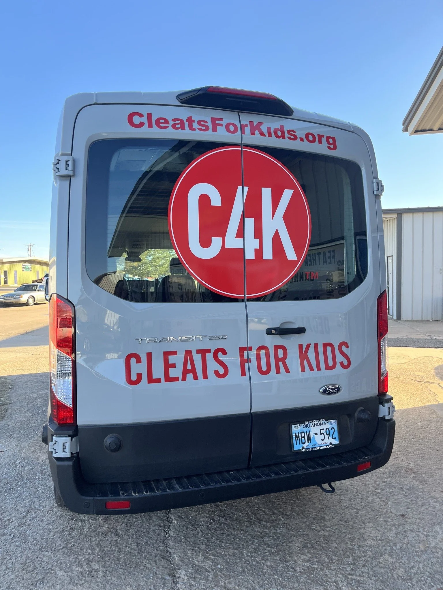 C4K Cleats for kids vehicle wrap bright color red