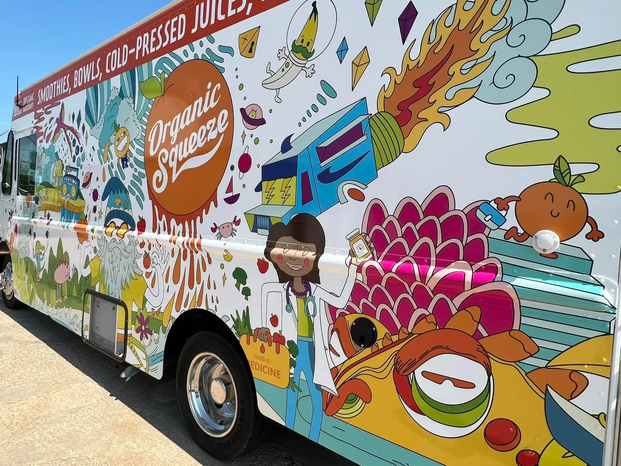 Colorful graphic of a food truck with illustrations of fruits, vegetables, smoothies, and a doctor character, promoting organic squeeze juice and fresh produce.