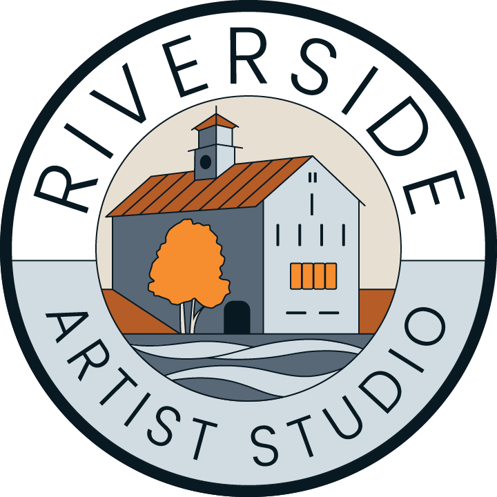 Logo for Riverside Artist Studio featuring a stylized barn with an orange roof, a tree, and water, encircled by the text 'Riverside Artist Studio'.