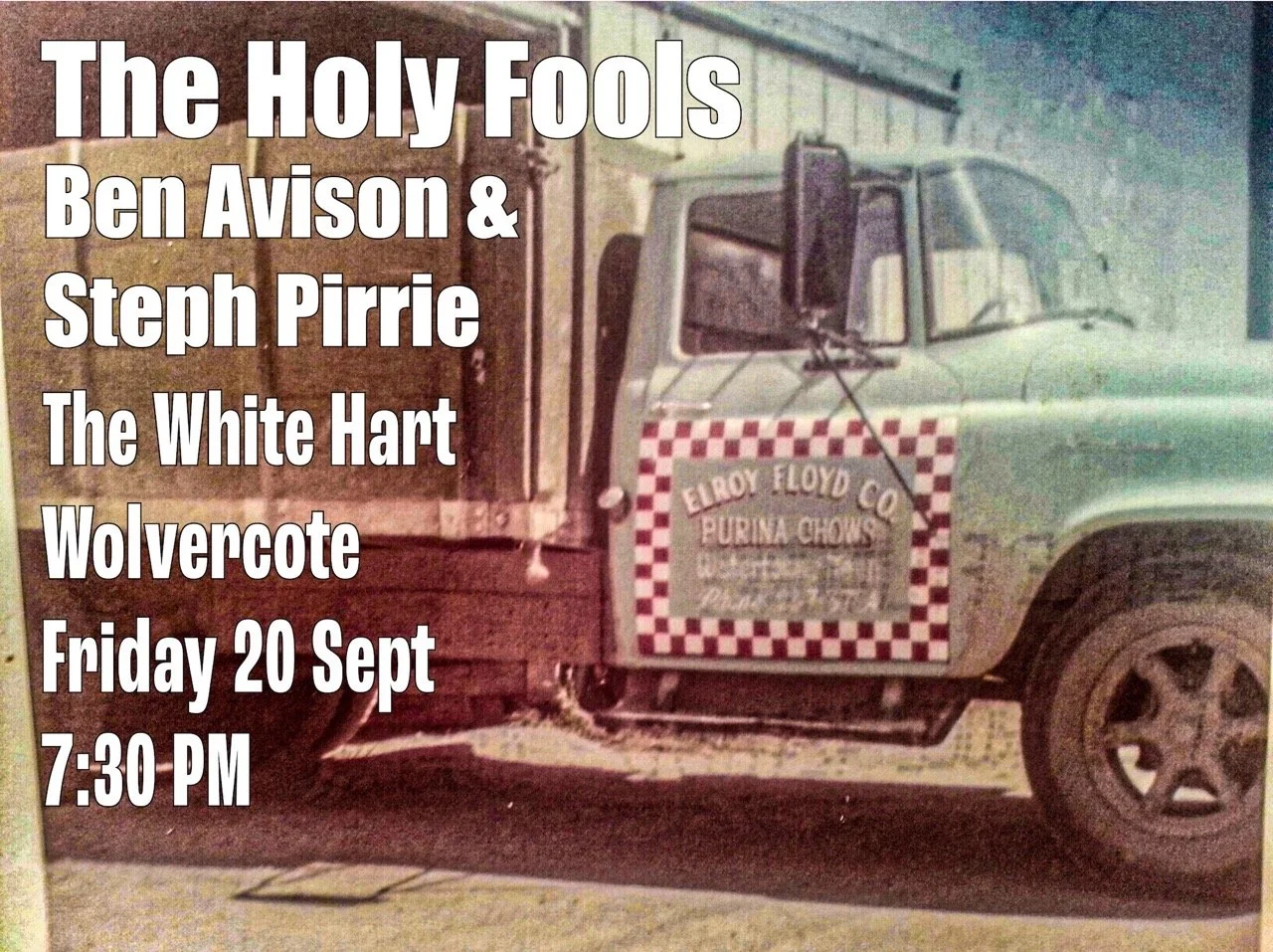 A vintage truck with a sign on its door that reads "Eroy Floyd Co. Purina Chows." Overlaid text announces a performance titled "The Holy Fools" featuring Ben Avison and Steph Pirrie, scheduled for Friday, September 20th at 7:30 PM.