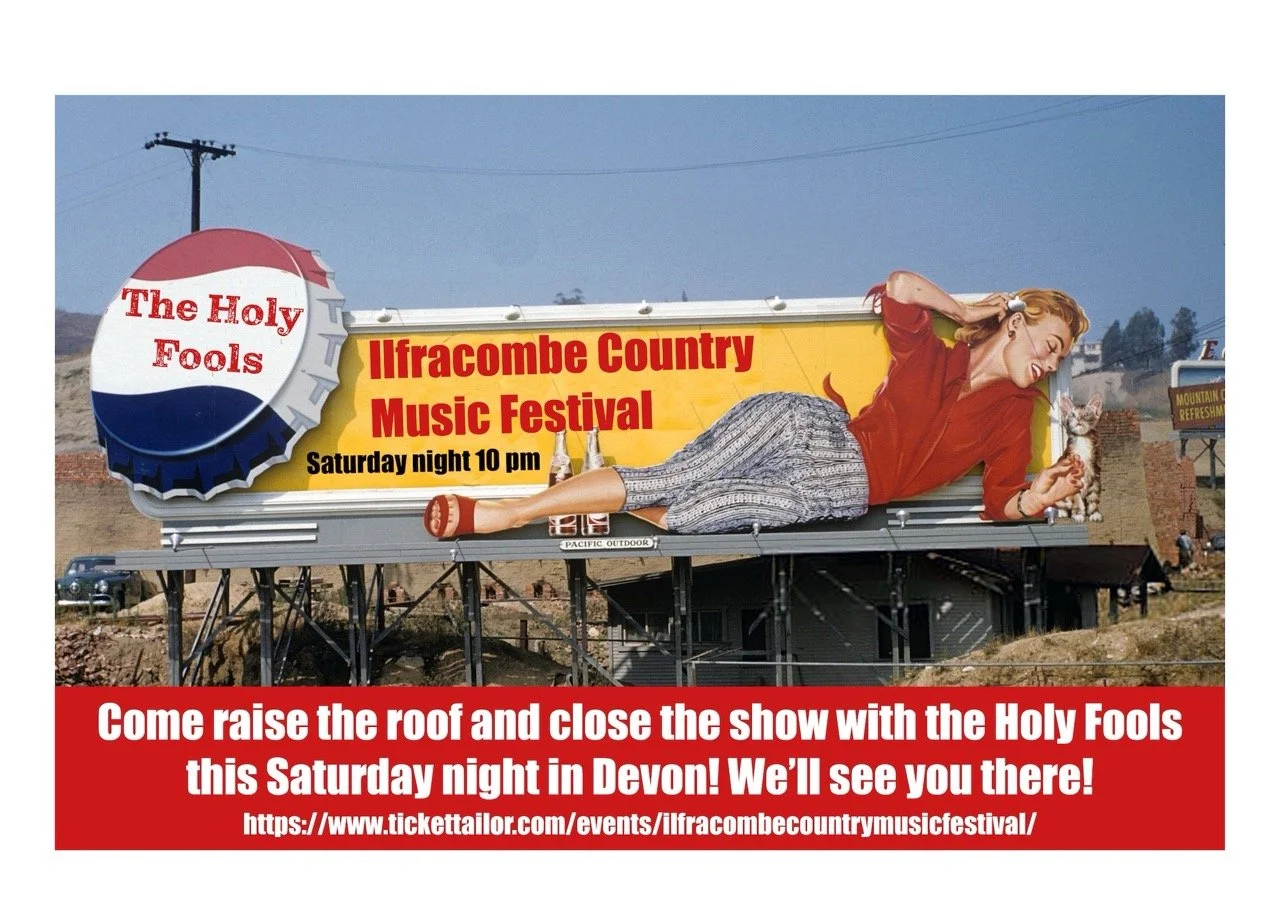 Billboard advertising the Ilfracombe Country Music Festival featuring a woman lying down, holding a cat, with a giant bottle cap logo that reads "The Holy Fools," and a red banner with event details.