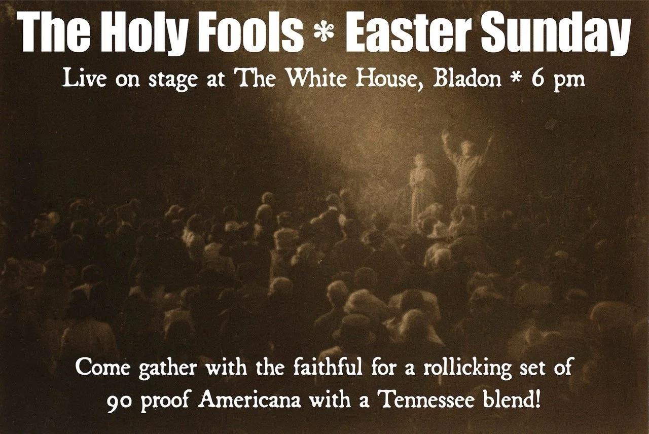 A vintage-style poster advertising an event called 'The Holy Fools' on Easter Sunday at 6 pm, live on stage at The White House, Bladon. The poster features a sepia-toned photo of an outdoor gathering with a crowd of people and a speaker with raised a
