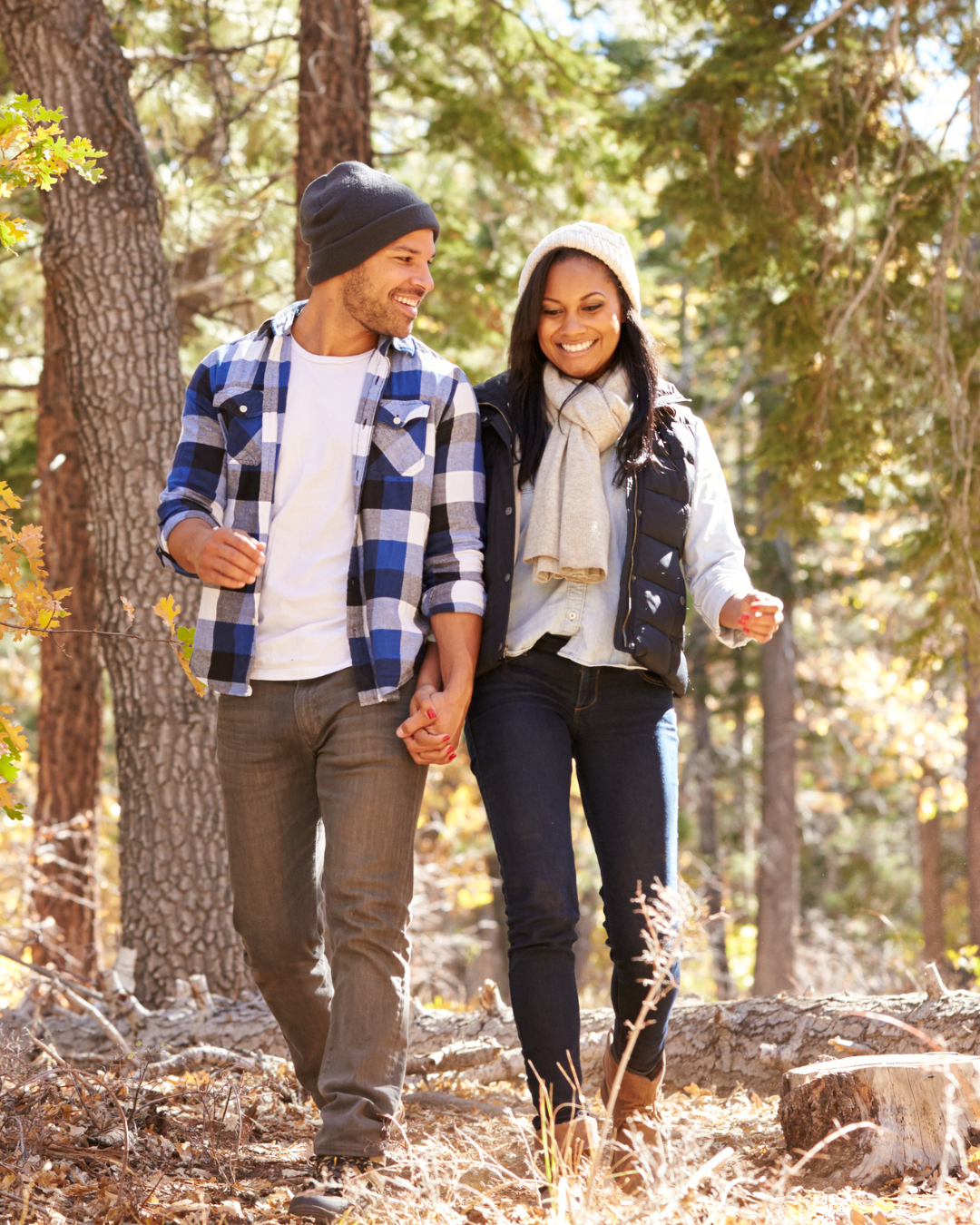 Couple in the woods, holding hands signifying unity that therapy may provide