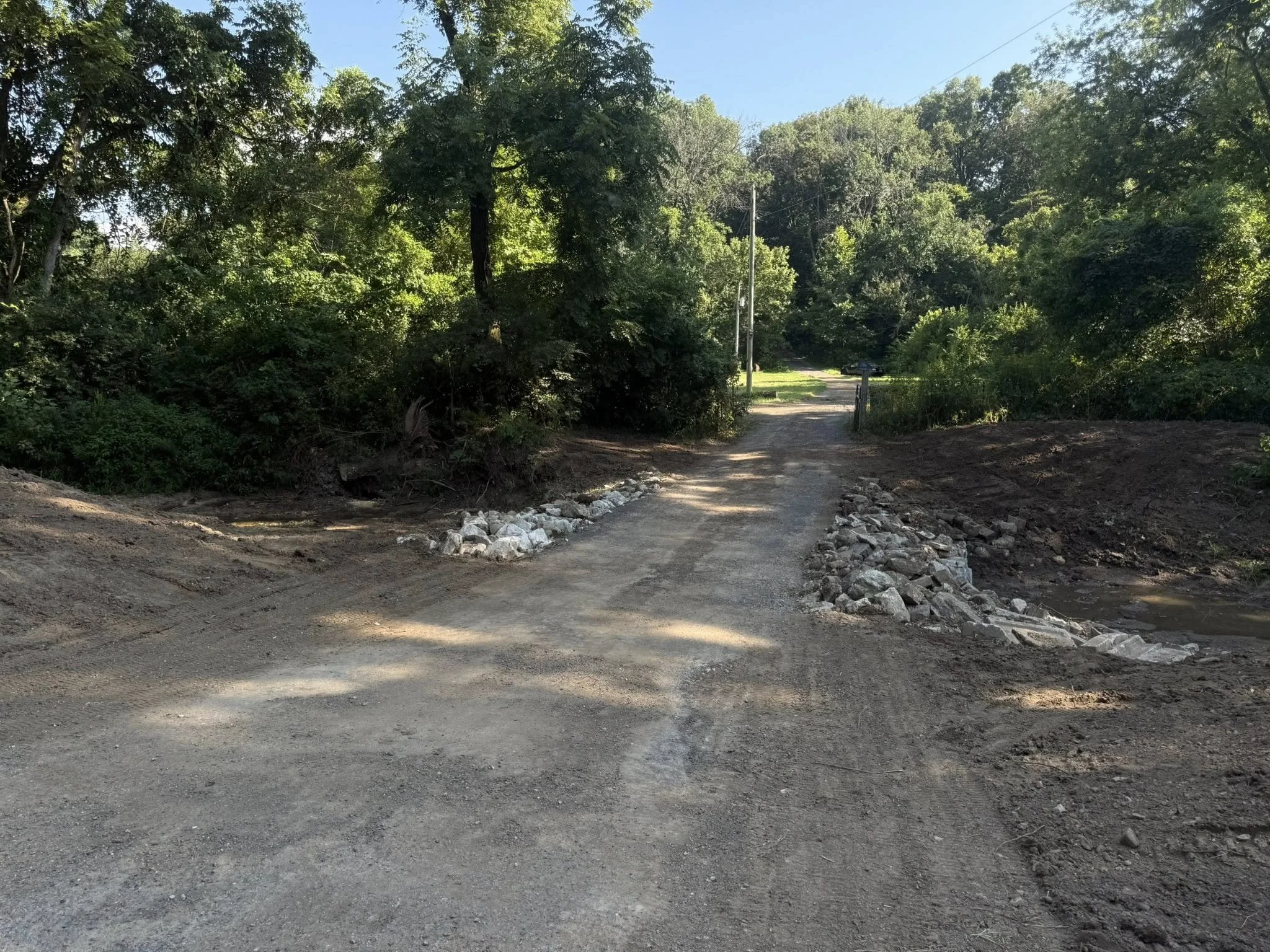 After
Overgrowth Gone in Driveway/Creek Entrance