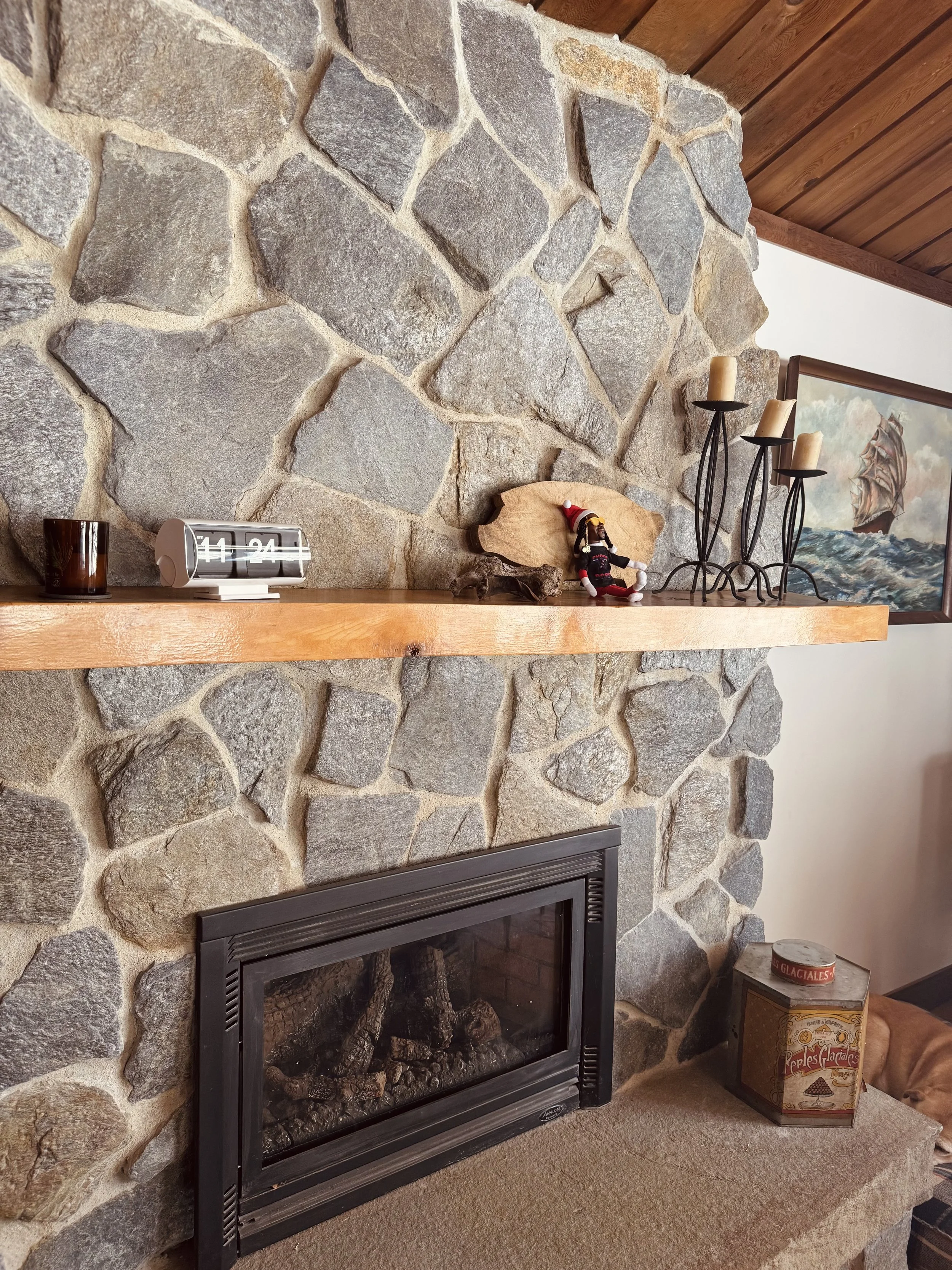 Vermont stone fireplace wood pig retro clock tall candles snoop on the stoop