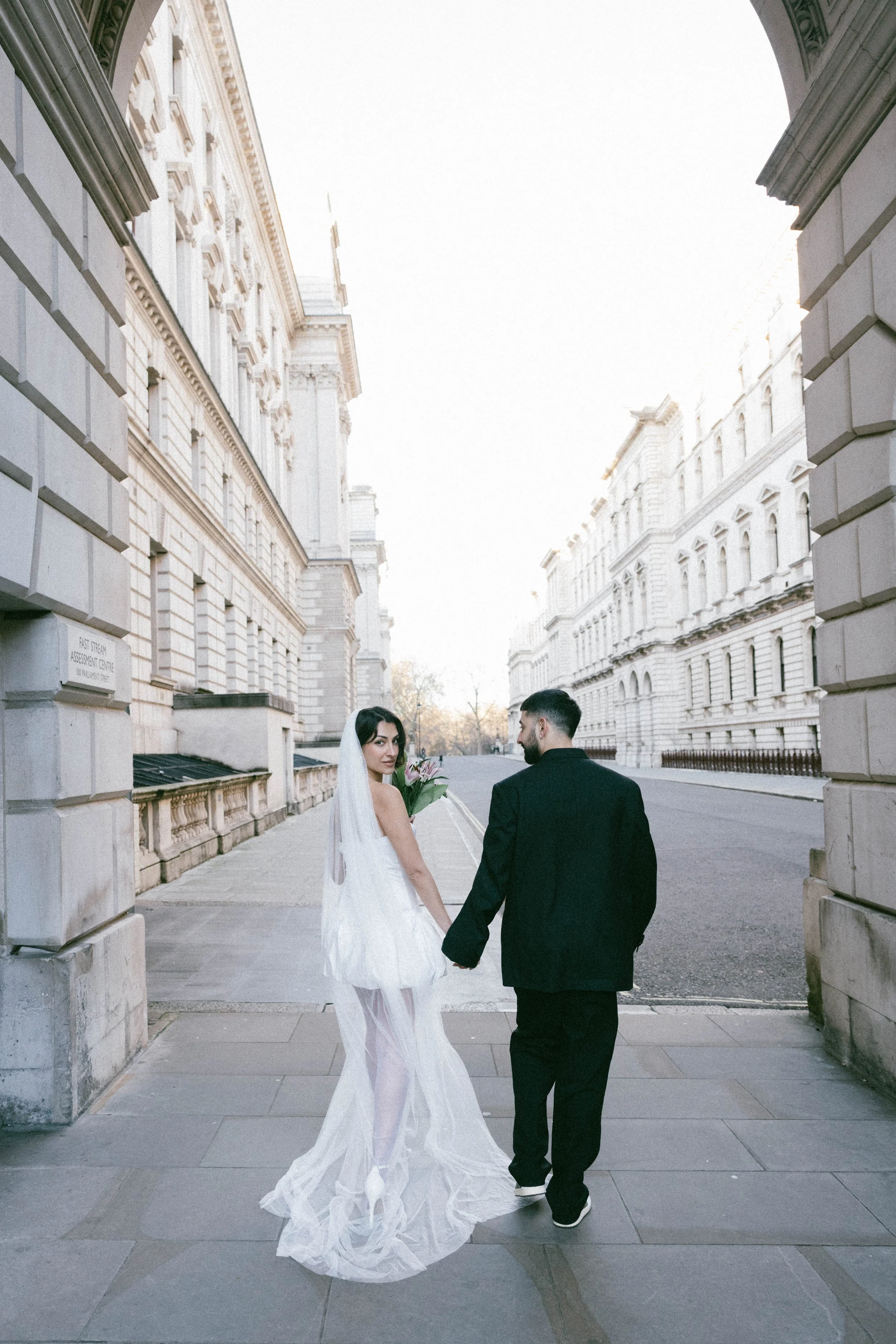 Cinematic Elopement portrait in Tower Hill, London, featuring historic stone architecture.