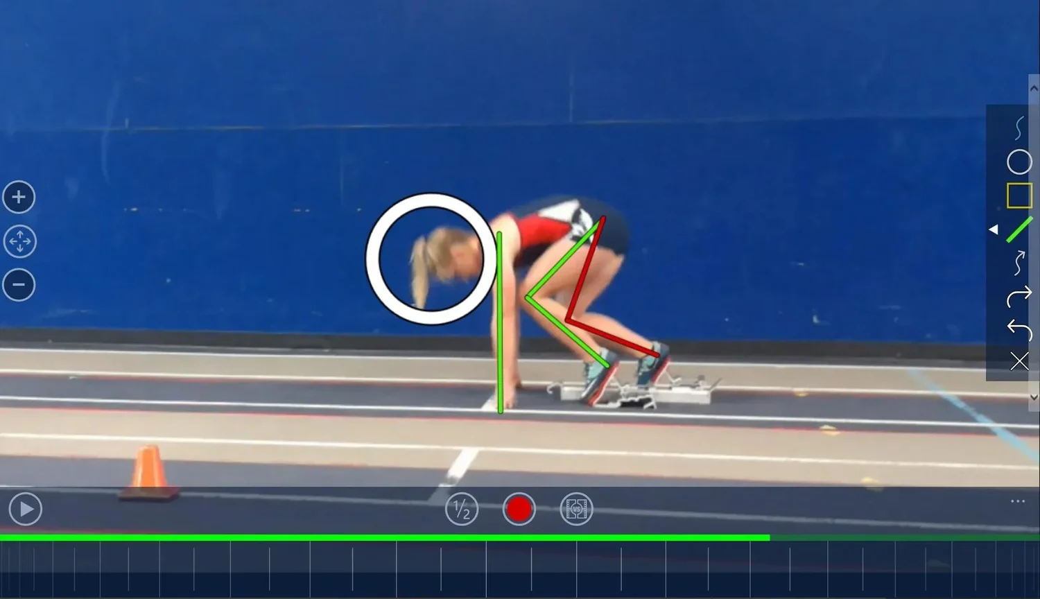 Track athlete in starting blocks with technical coaching overlay