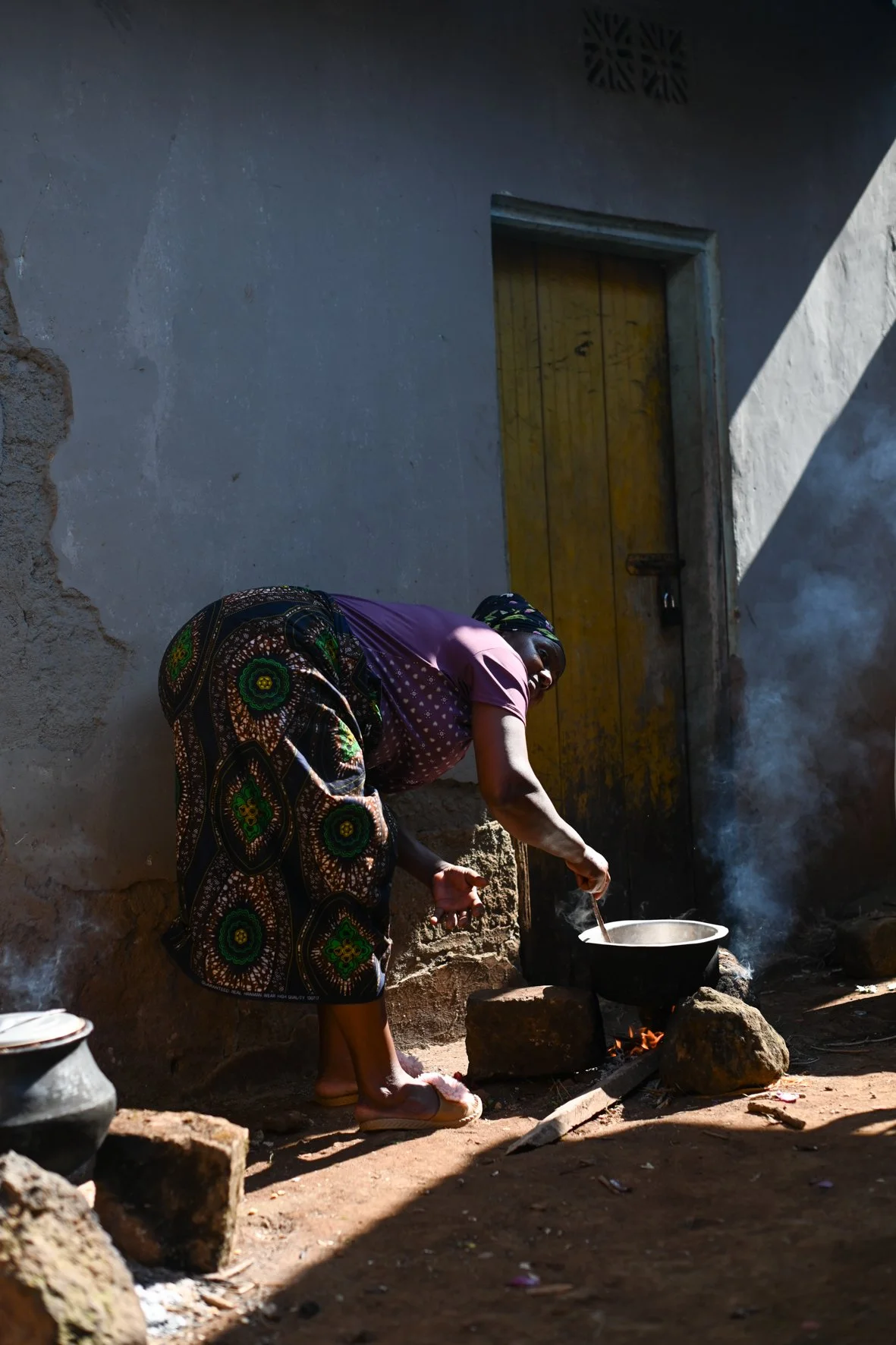 Woman preparing food in rural Tanzania.