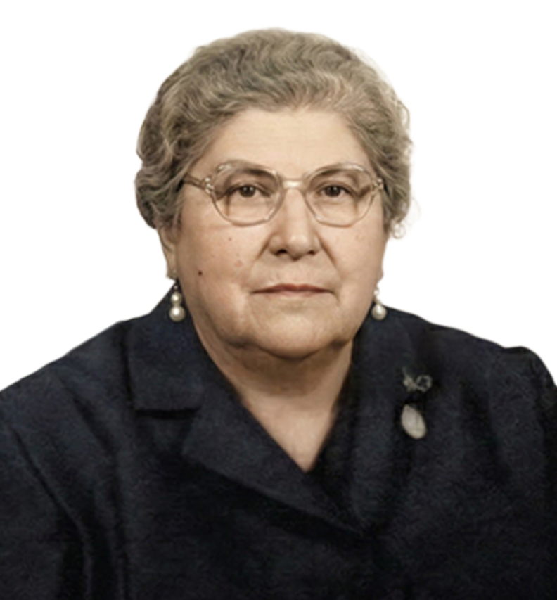 Original portrait of Marie de Caba. An older woman with short curly gray hair, wearing glasses, pearl earrings, and a dark jacket with a lapel pin.