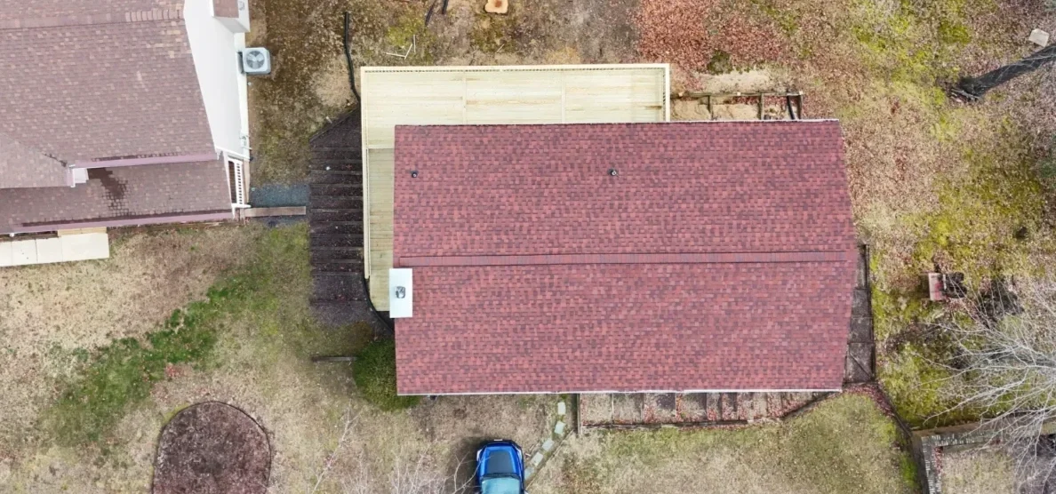 Long elevated deck and walkway built by a deck contractor in Laurel, MD along a wooded hillside