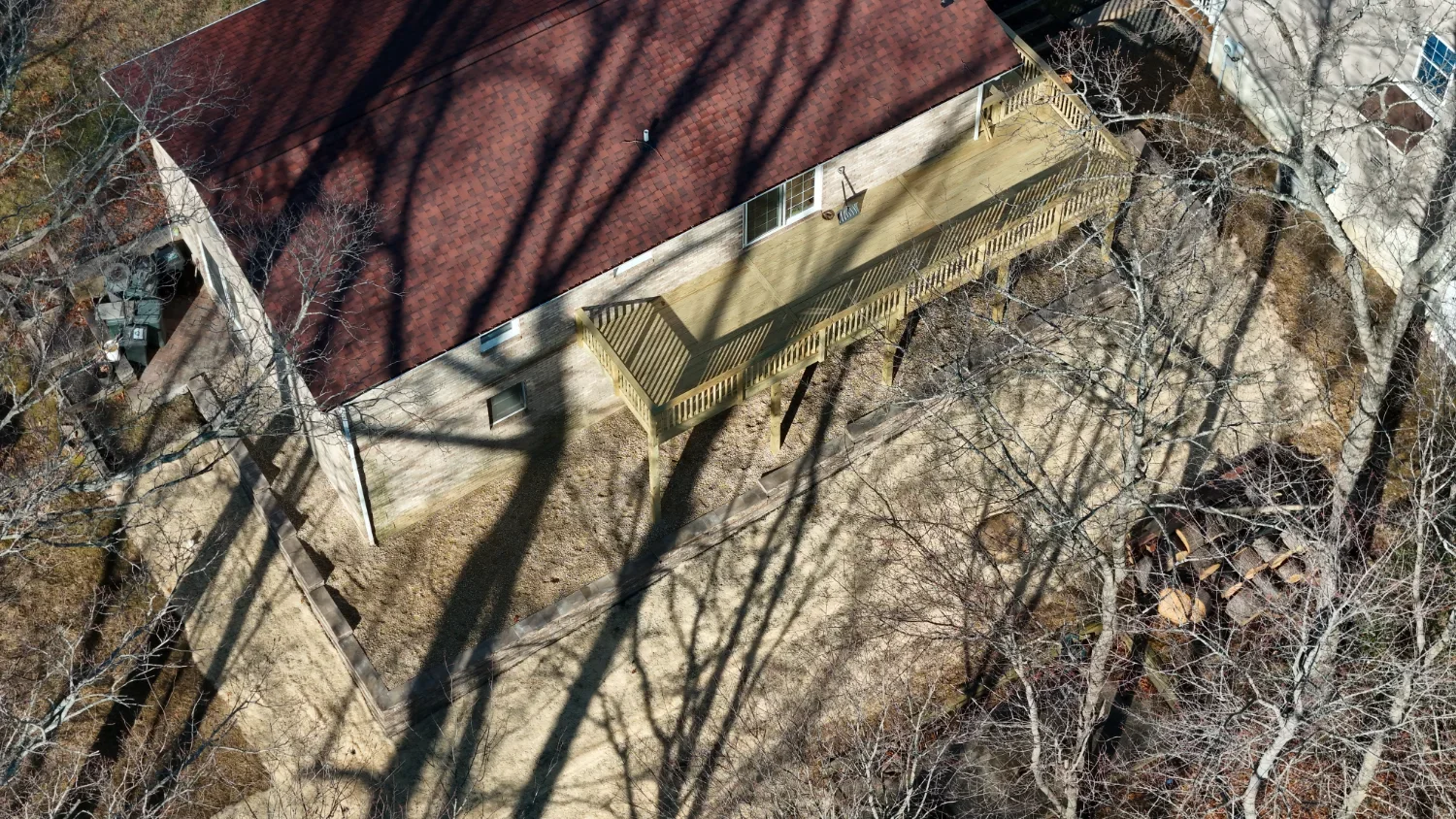Elevated wood deck attached to a brick house by a deck contractor in Laurel, MD