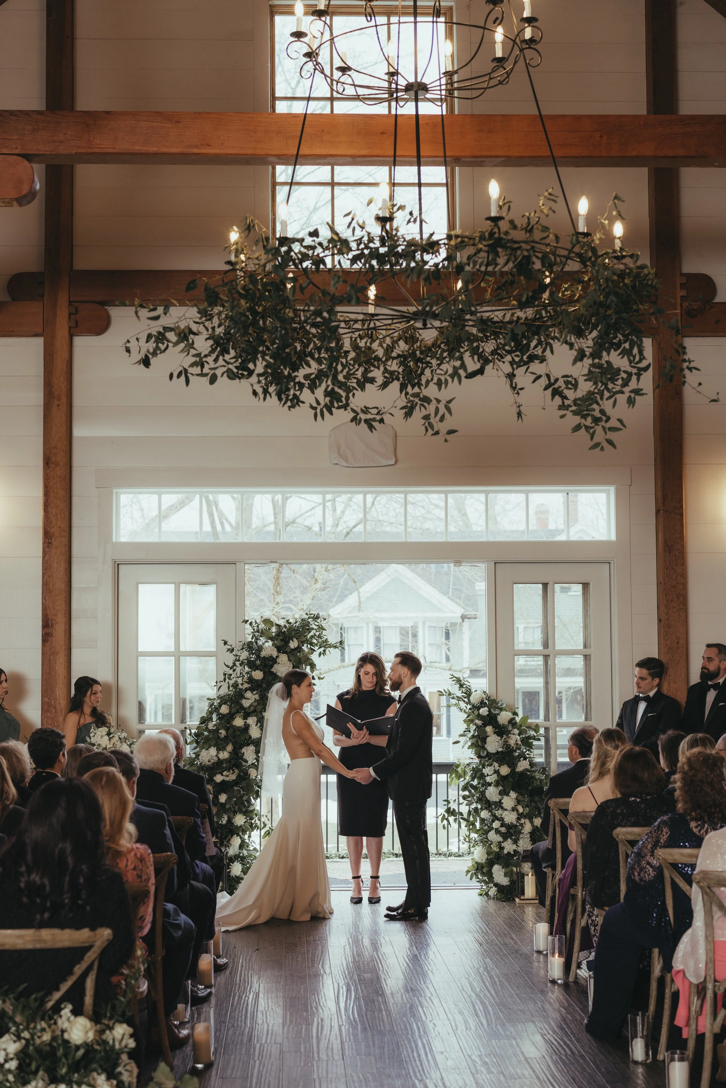 Wedding officiant leading Bethany and Shane’s warm, spring wedding ceremony at the Thompson Inn in Durham, New Hampshire