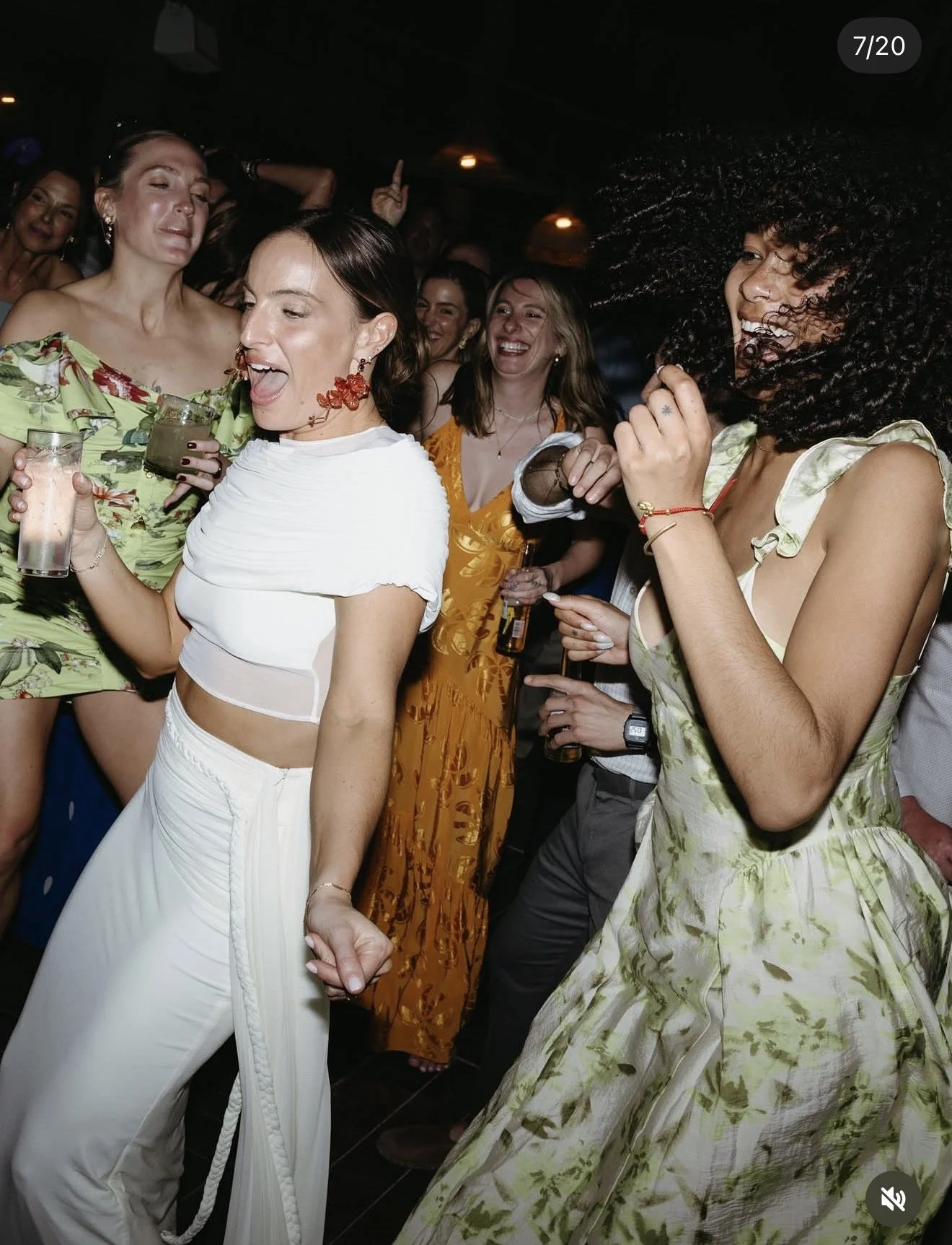 Women celebrating together at a lively wedding or private event in Holbox.