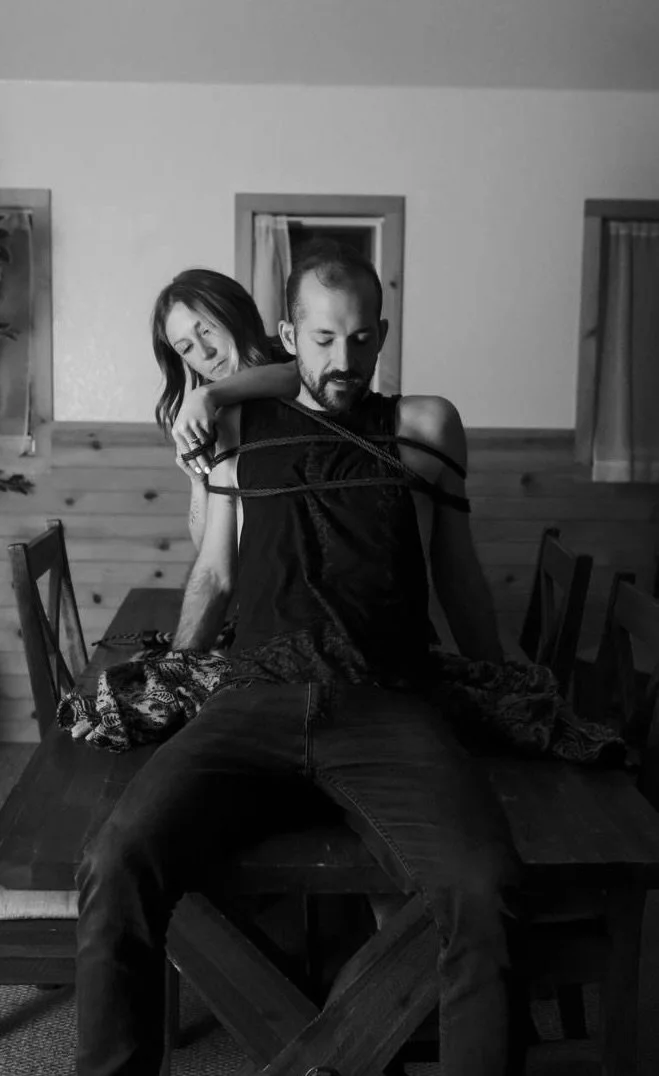 Shelby Lee guiding a client through a rope bondage session in her Denver studio