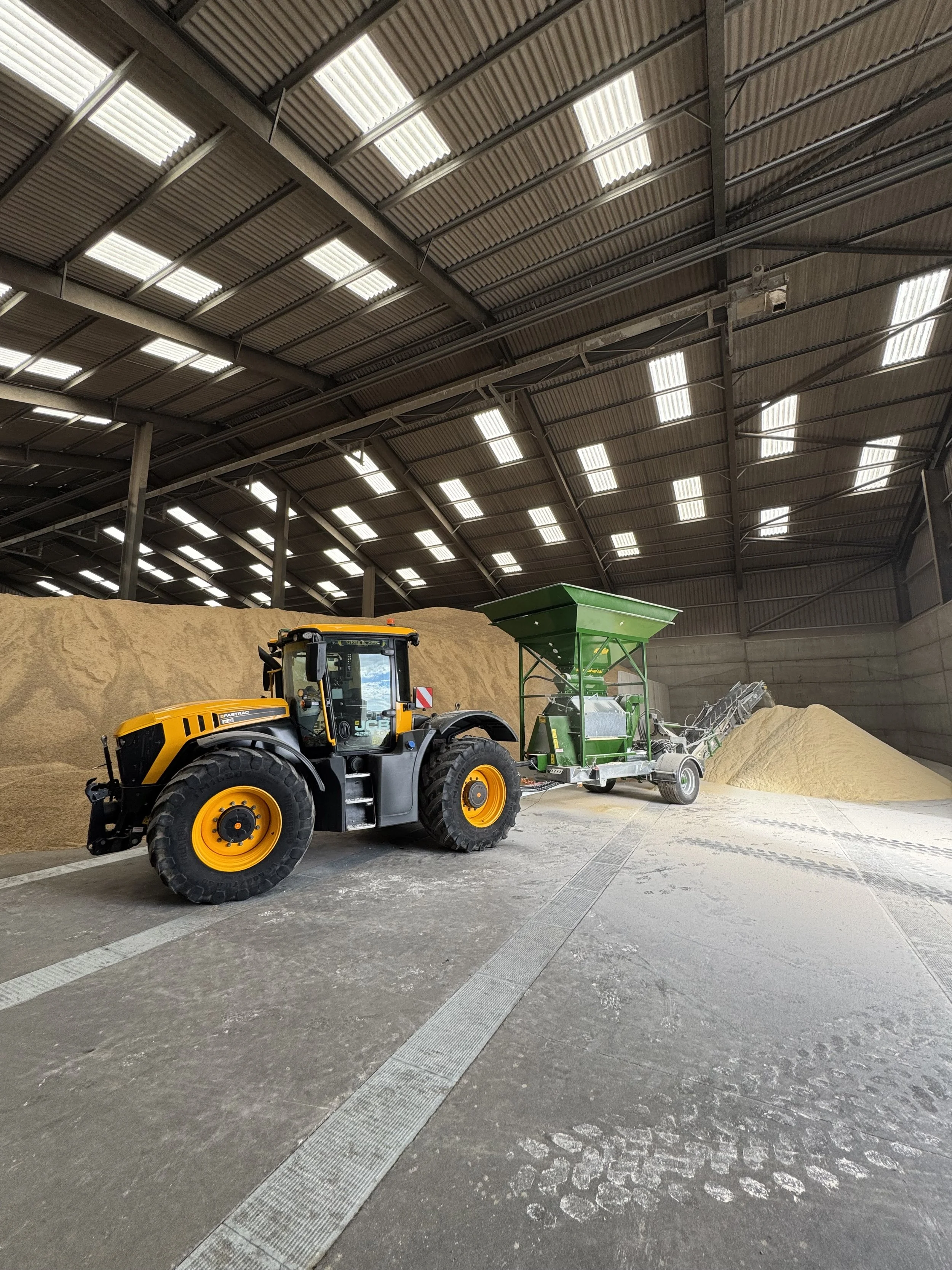 Mobile grain rolling service operating on a UK farm
Mobile hammer mill	Mobile hammer milling service for farms and grain stores
Mobile mill beside grain store	On-farm mobile grain processing at a customer grain store
Grain entering mobile mill	Farm-s