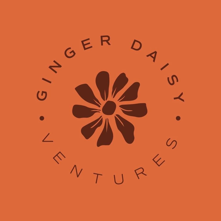 A stylized flower with eight petals in dark brown on an orange background, with the words "Ginger Daisy Ventures" arranged in a circle around the flower.