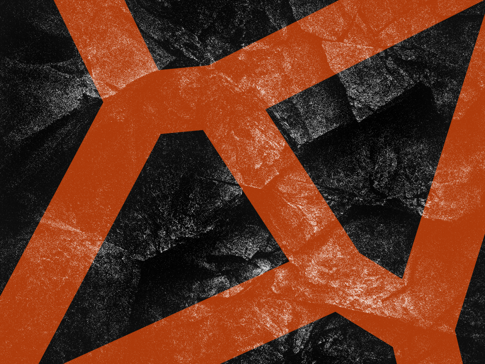 Abstrakti kuvio, jossa on mustia ja oransseja muotoja ja tekstuureja.