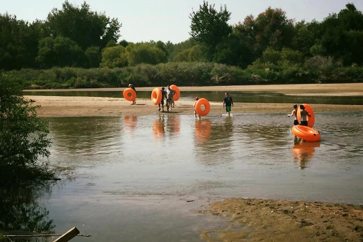 16 RFR People with Floats in River.jpg