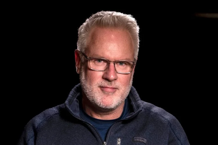 John Moore, Pulitzer Prize-winning photojournalist covering global conflicts, immigration, and humanitarian crises across six continents