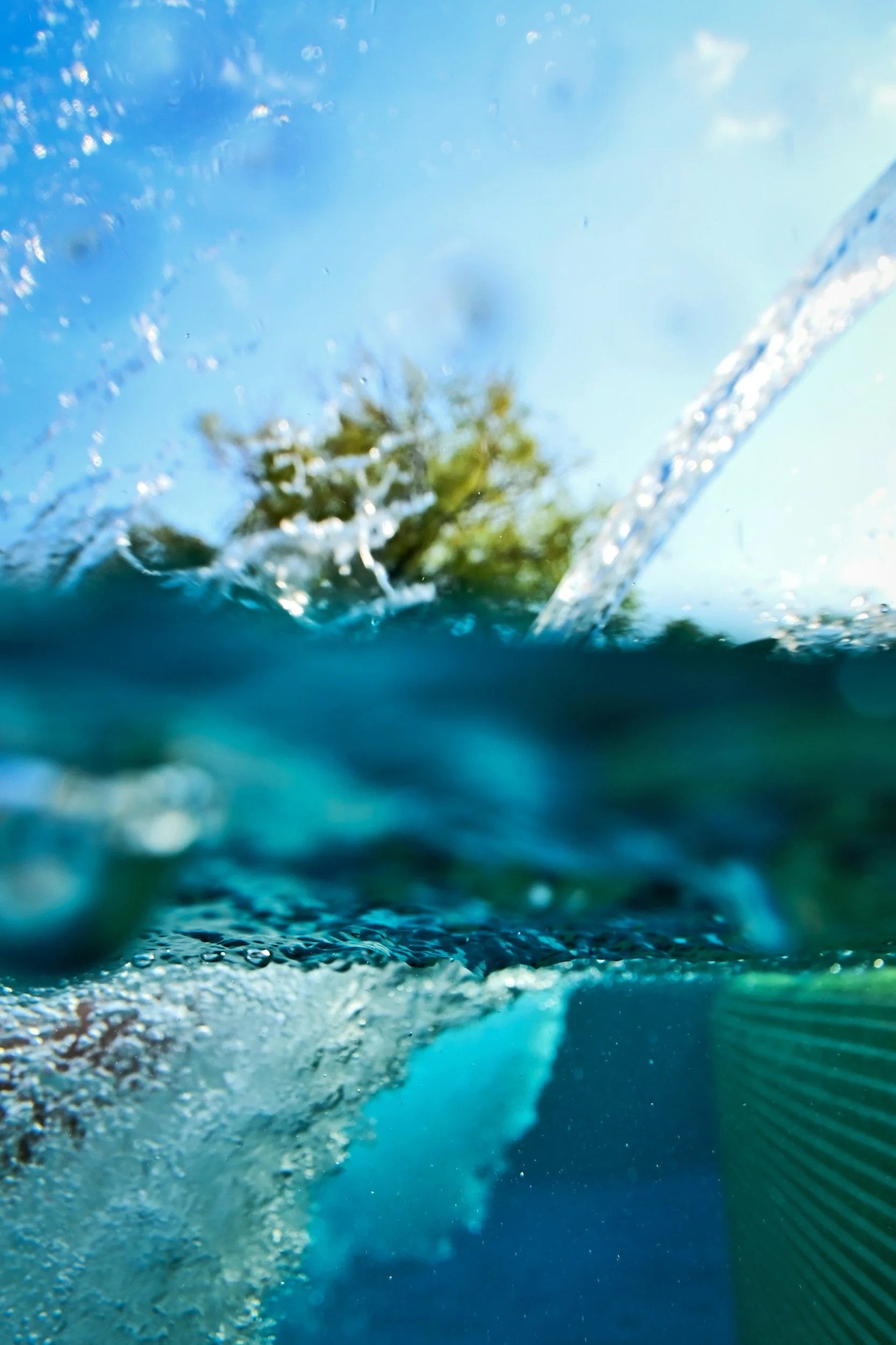 Close-up of water splashing and bubbles forming.