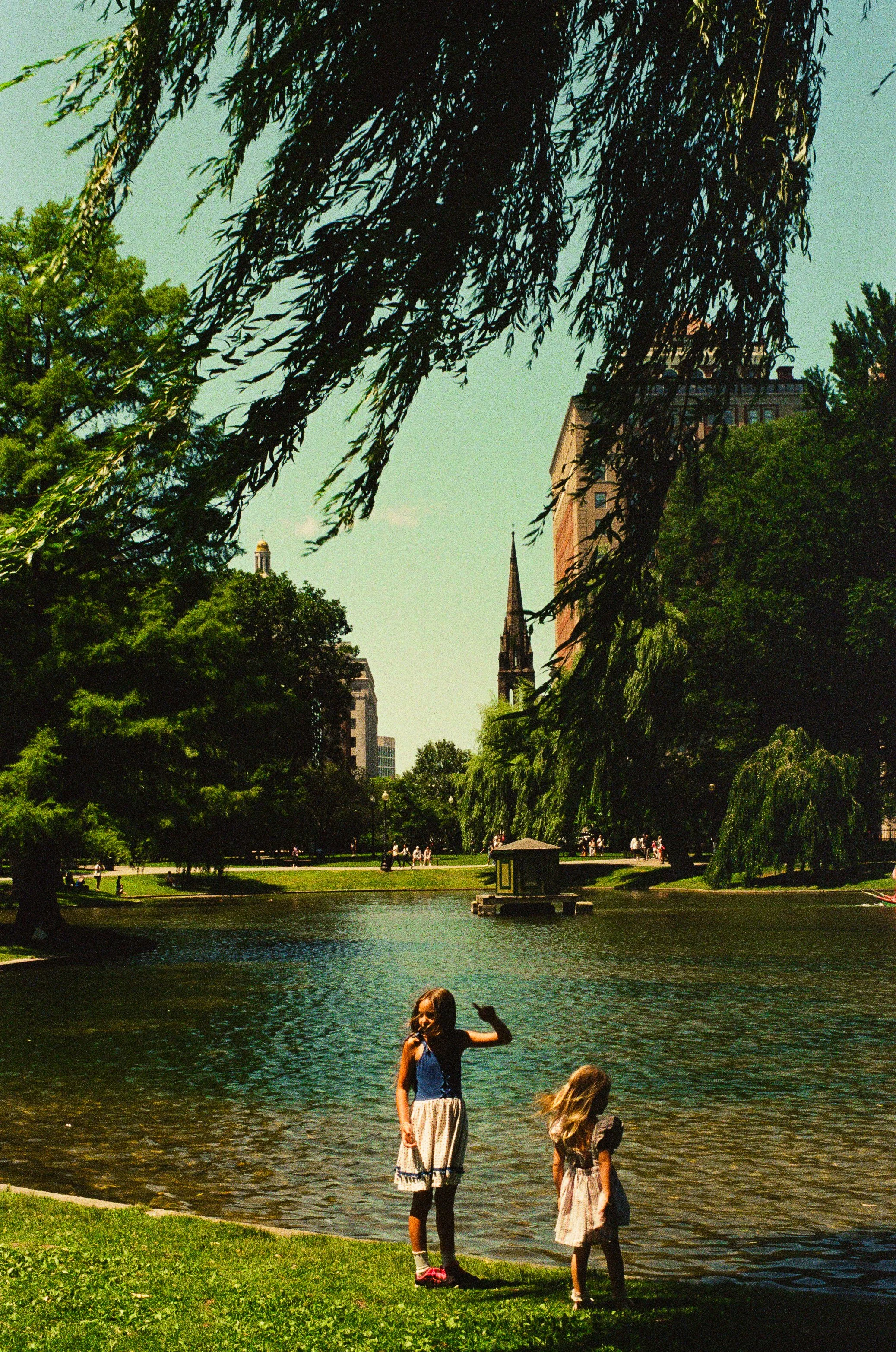 Girls in Boston Public Garden with church