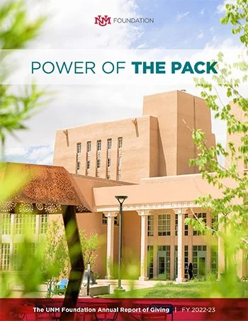 Cover of the UNM Foundation Annual Report of Giving for 2022-23, titled 'Power of the Pack', featuring an image of a modern building with beige and tan architecture.