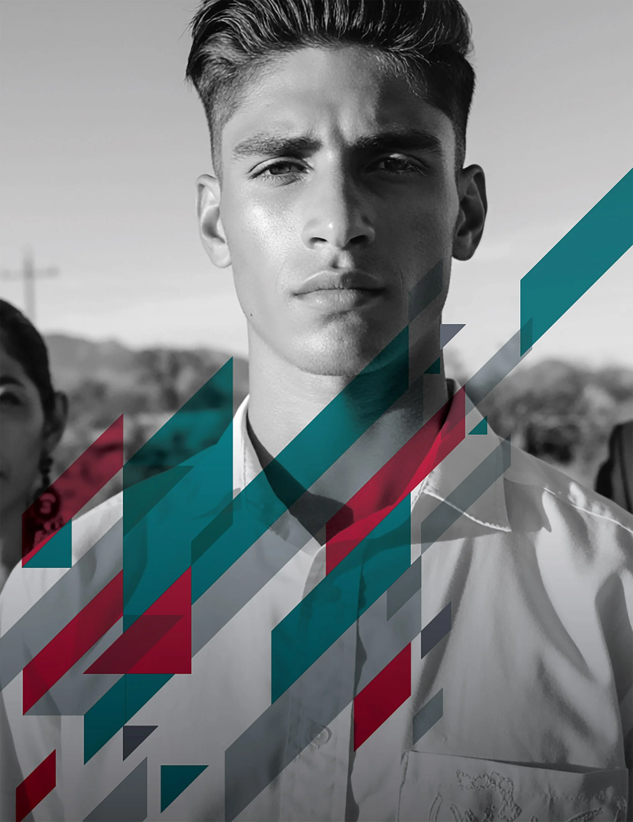 Black and white portrait of a young man with styled hair, wearing a collared shirt, with a serious expression, outdoors with a blurred background, overlaid with colorful geometric patterns.