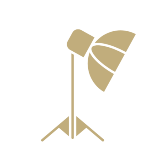 Silhouette of a spotlight on a tripod stand.