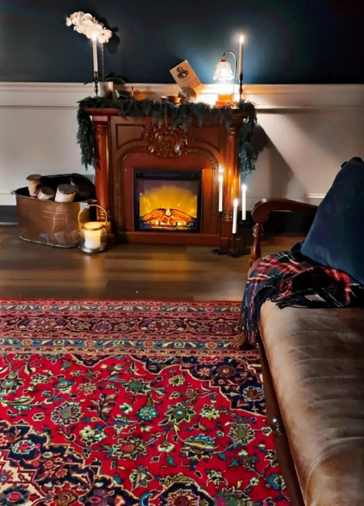 The sitting room at Old Town Healing, with armchairs by the fireplace