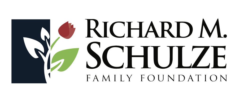 Logo for the Richard M. Schulze Family Foundation featuring a stylized plant with green leaves and a red flower, alongside the foundation's name in black text.