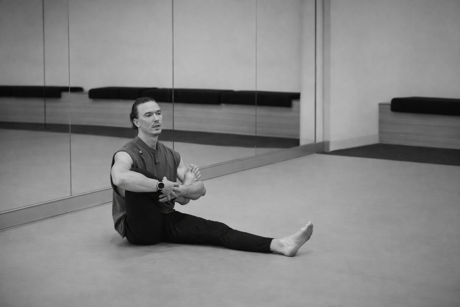 alex doing a demonstration of a yoga stretch