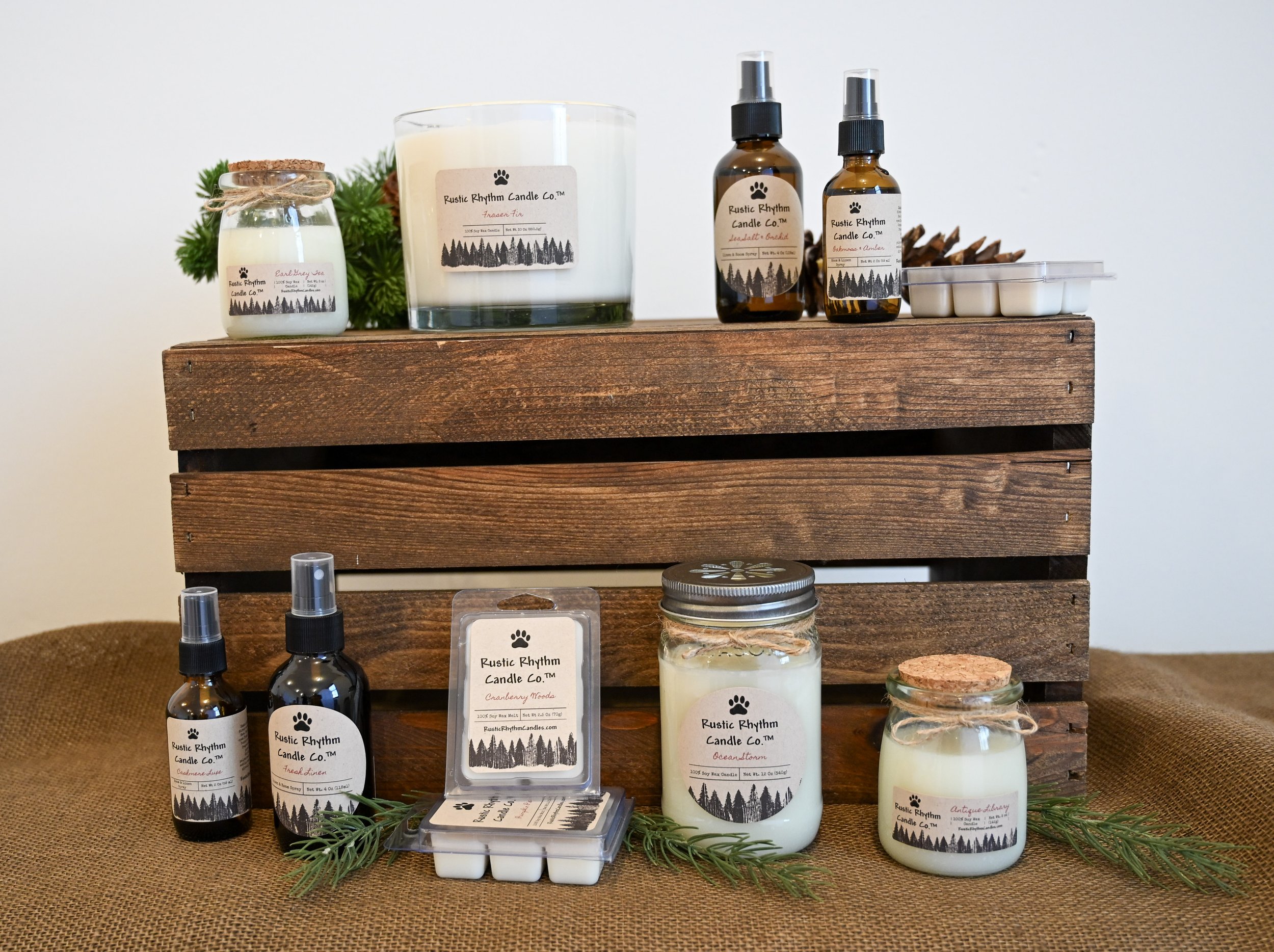 Rustic Rhythm Candle Co.™ products displayed on a wooden crate