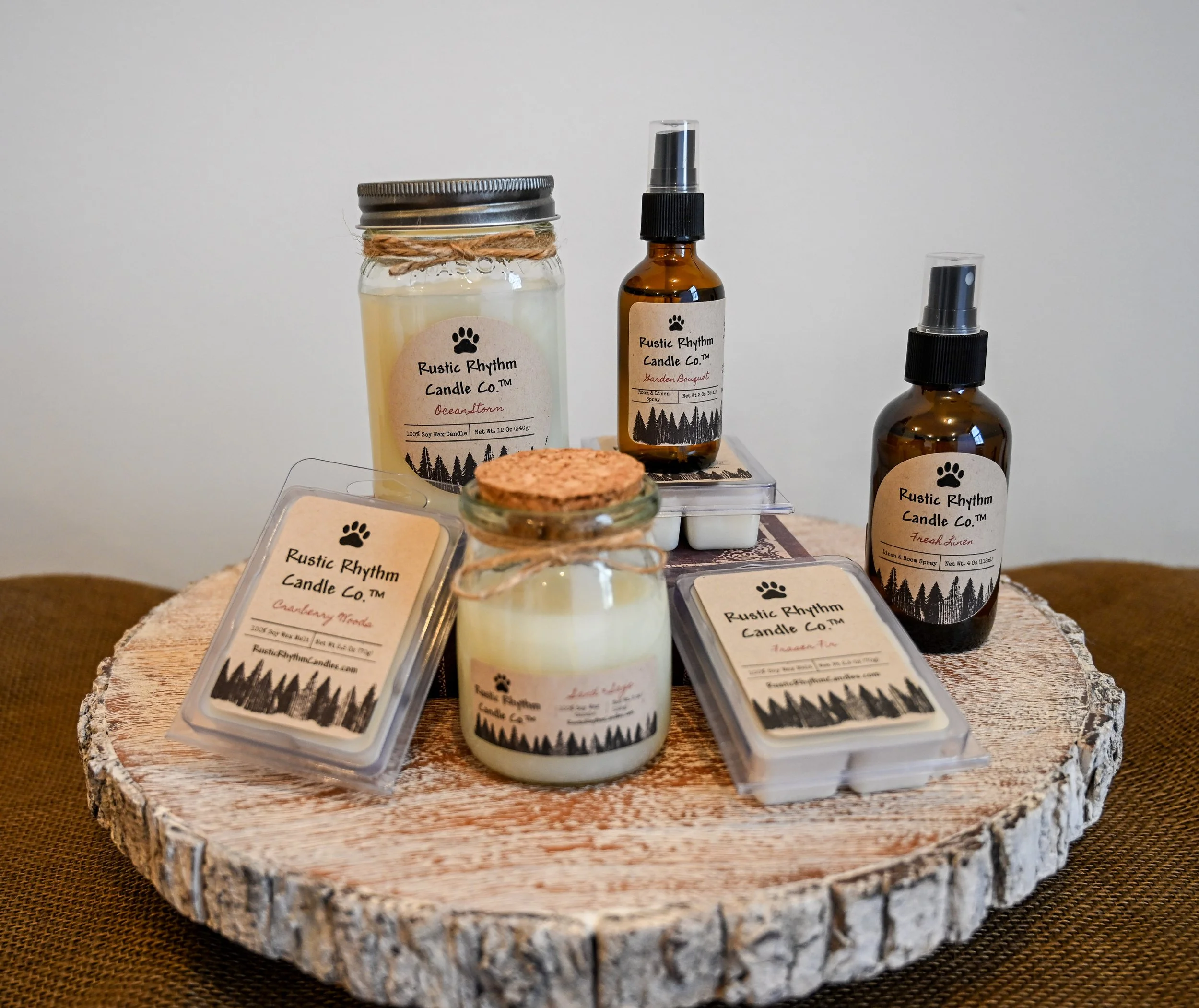 Rustic Rhythm Candle Co.™ products displayed on a stand
