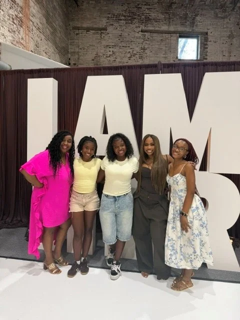 Shandia Booker with a group at the Future Her community event.