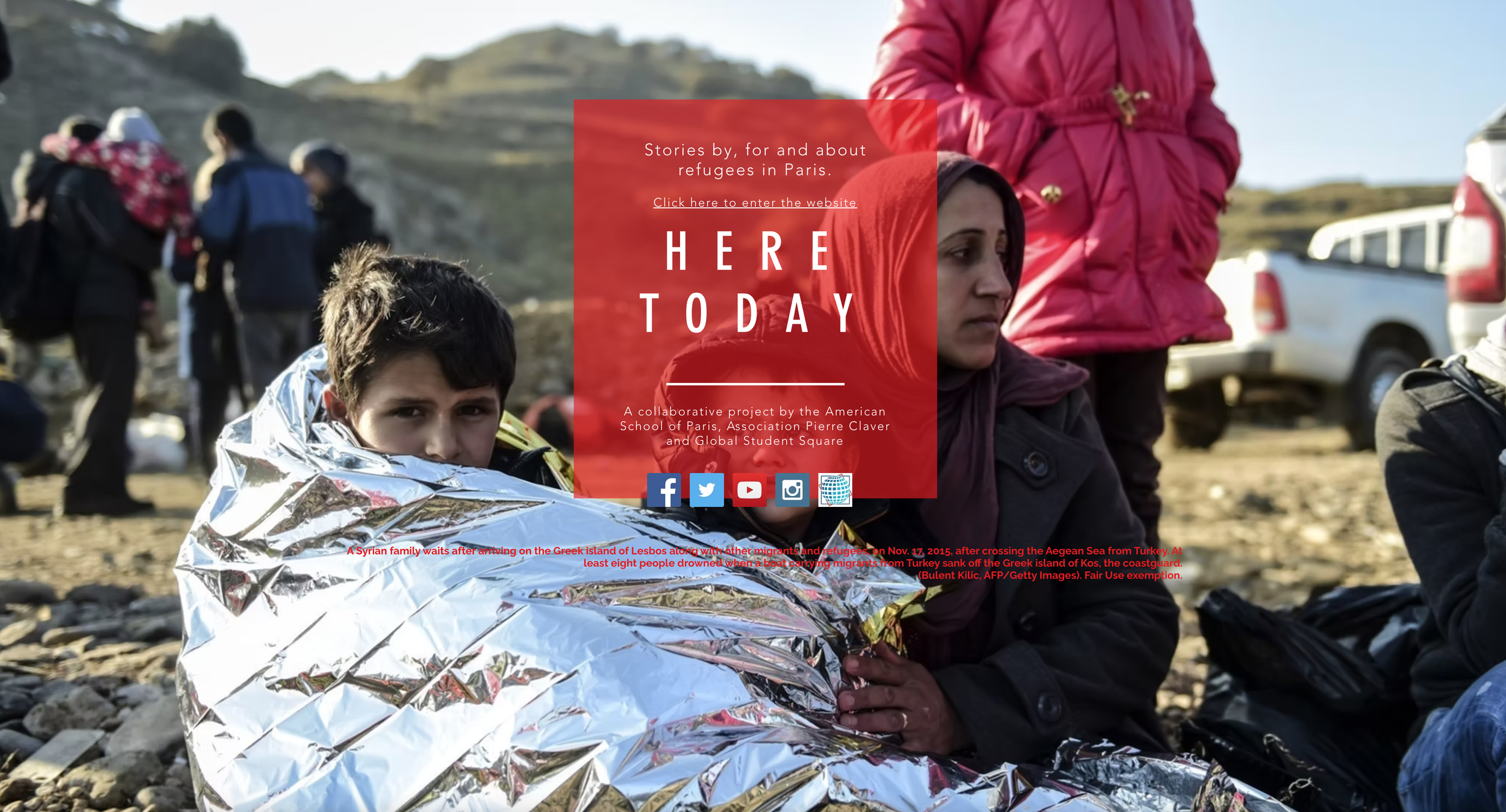 A Syrian family, including a boy wrapped in a silver emergency blanket and a woman with a red headscarf, sits on a rocky ground beside vehicles, waiting after arriving on the Greek island of Lesbos amid migration from Turkey.