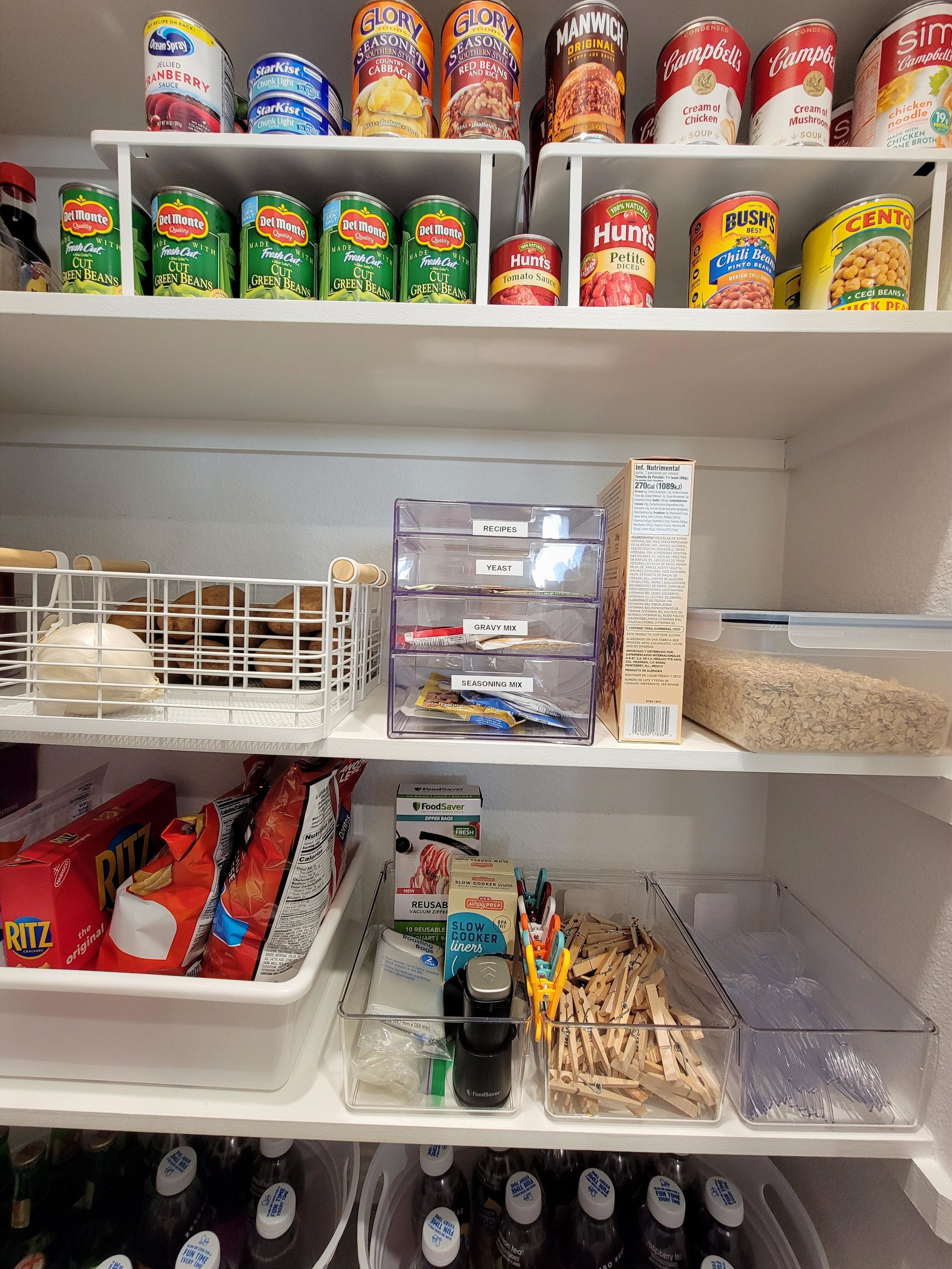 Pantry organization project close-up. Utilized metal shelf risers for canned goods and containers client already owned.  