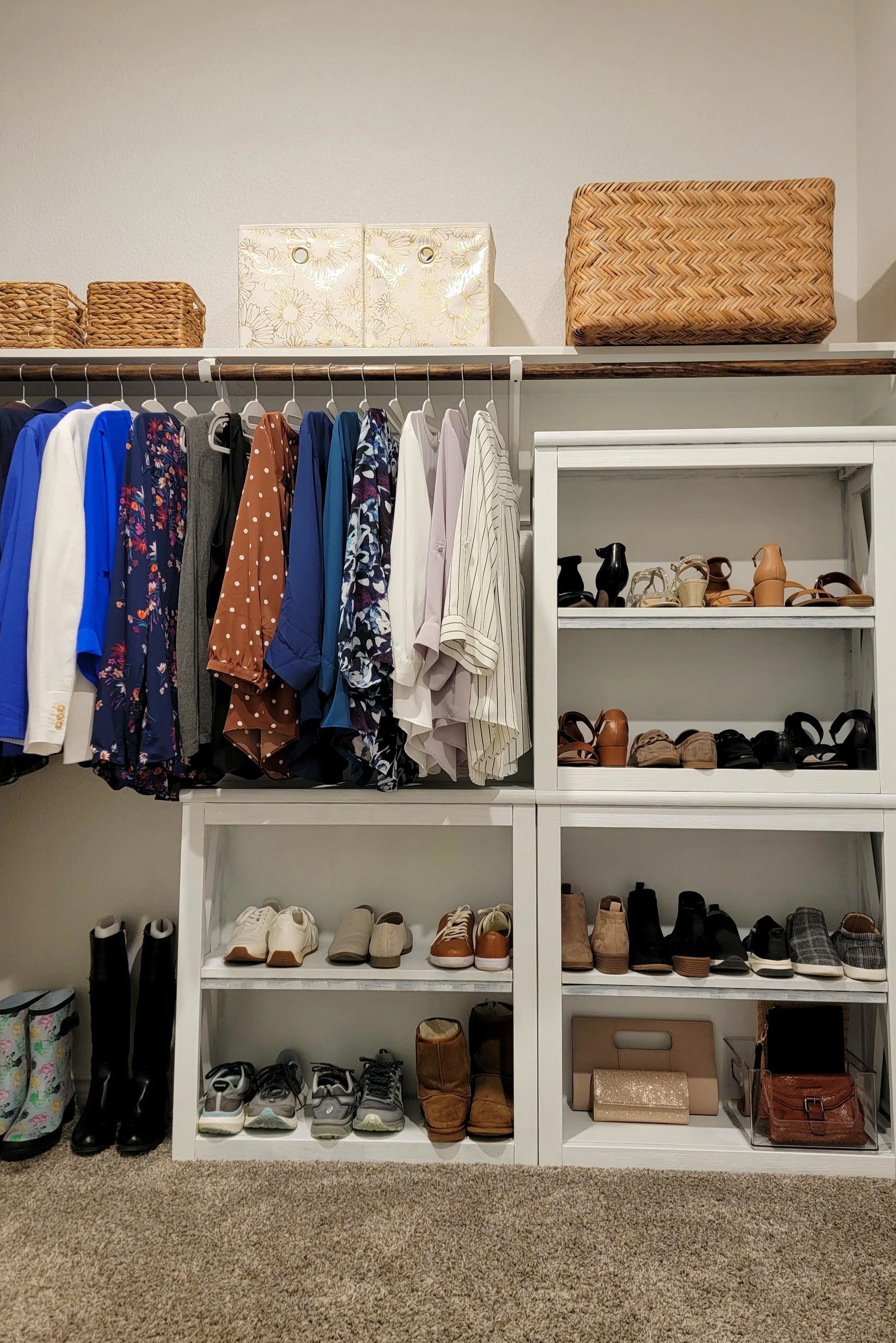 Primary closet organization utilizing 3 small shelving units client already owned to display shoes and bags.
