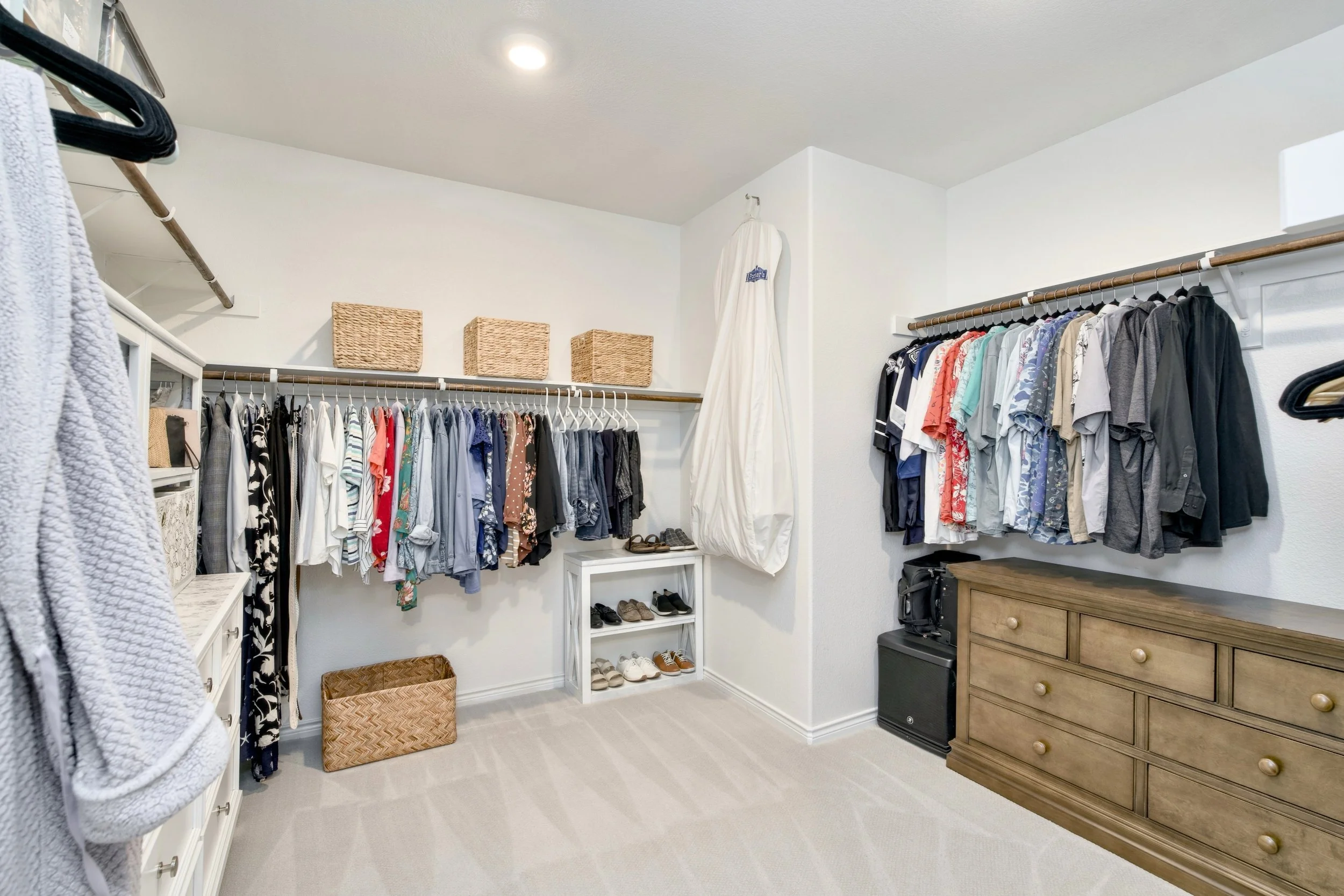 Primary closet styled for listing photos.