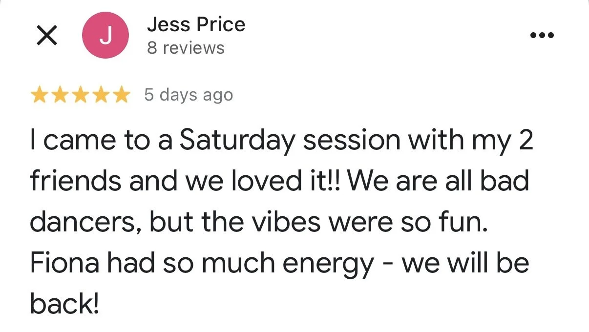 Two minimalist ceramic vases on a surface, one with dried flowers and seed heads, against a plain neutral background.