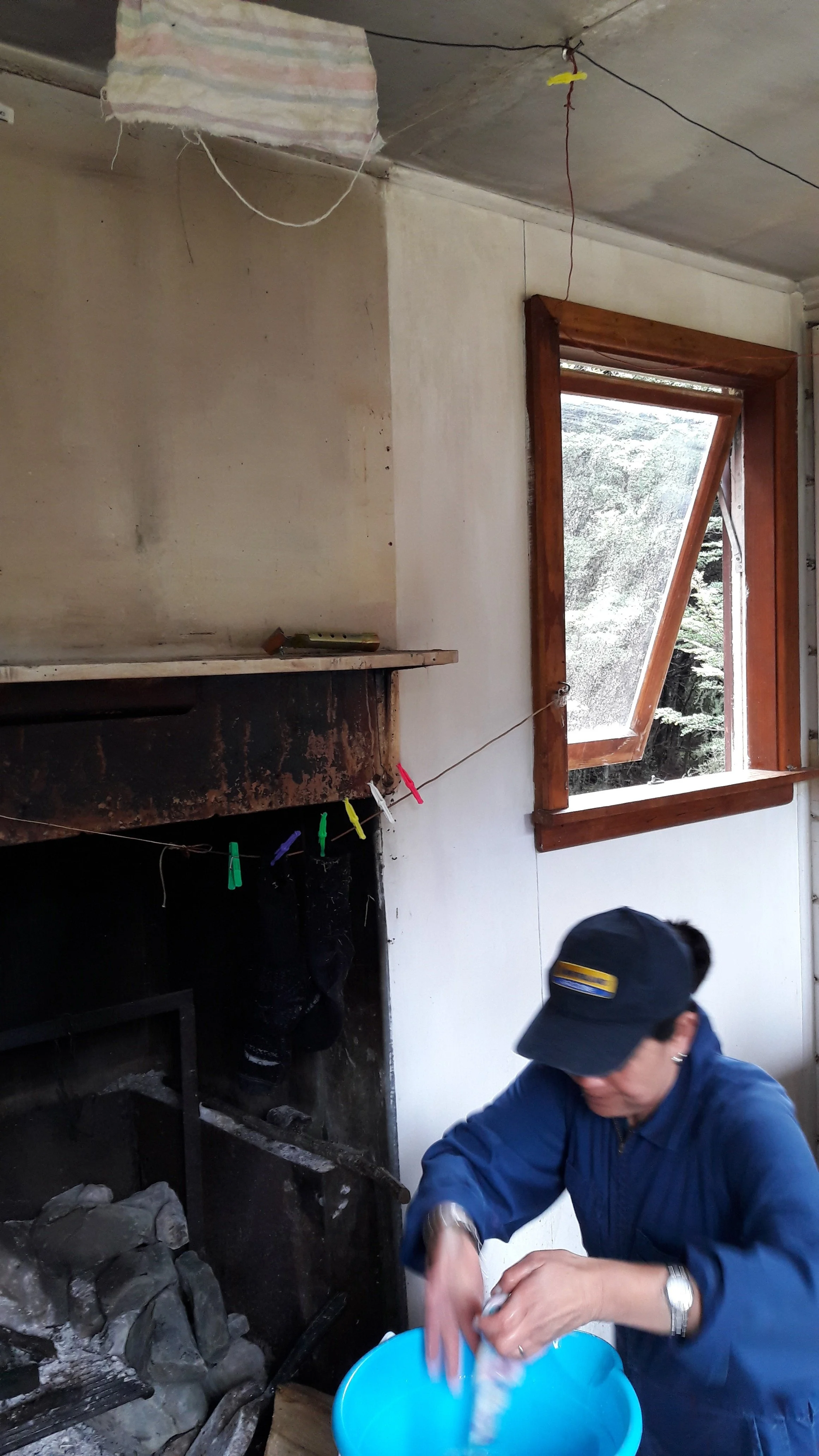 16 April - Tania cleaning living space wall.jpg