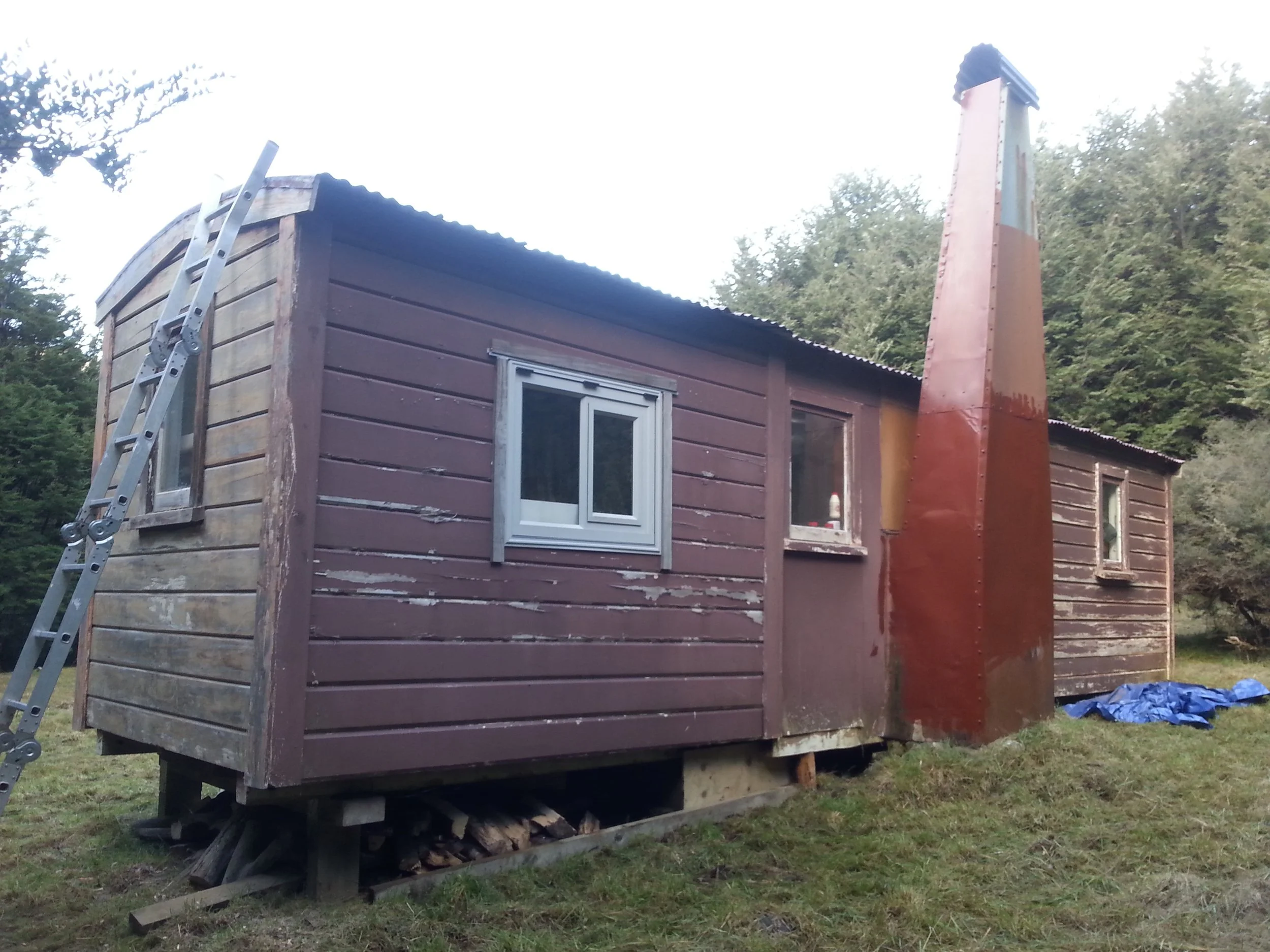 24 April - South wall of hut with painted chimney.jpg