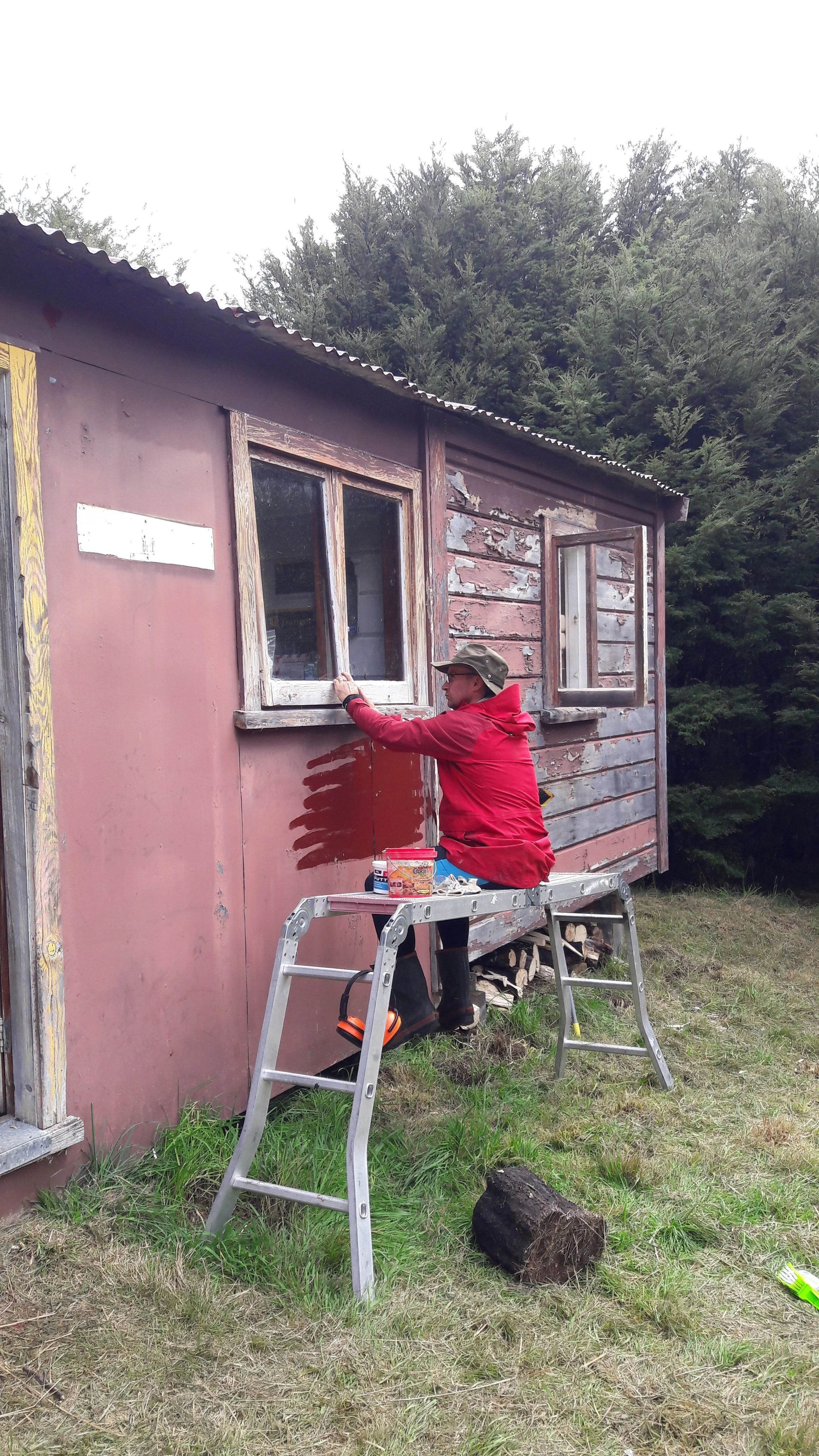 16 April - Rodney putting putty around window.jpg