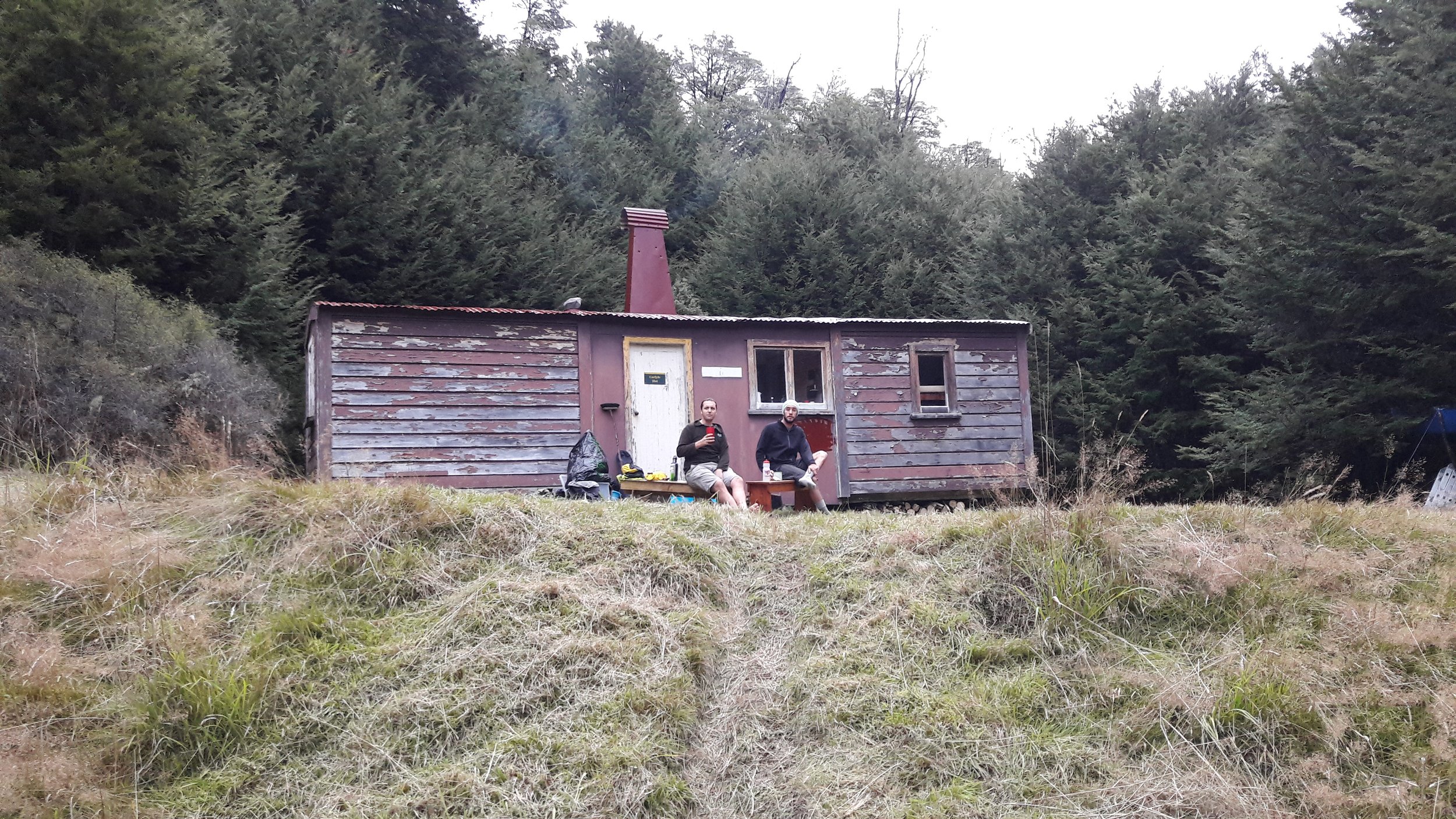 16 April - Daniel and Will in front of newly painted roof and chimney.jpg