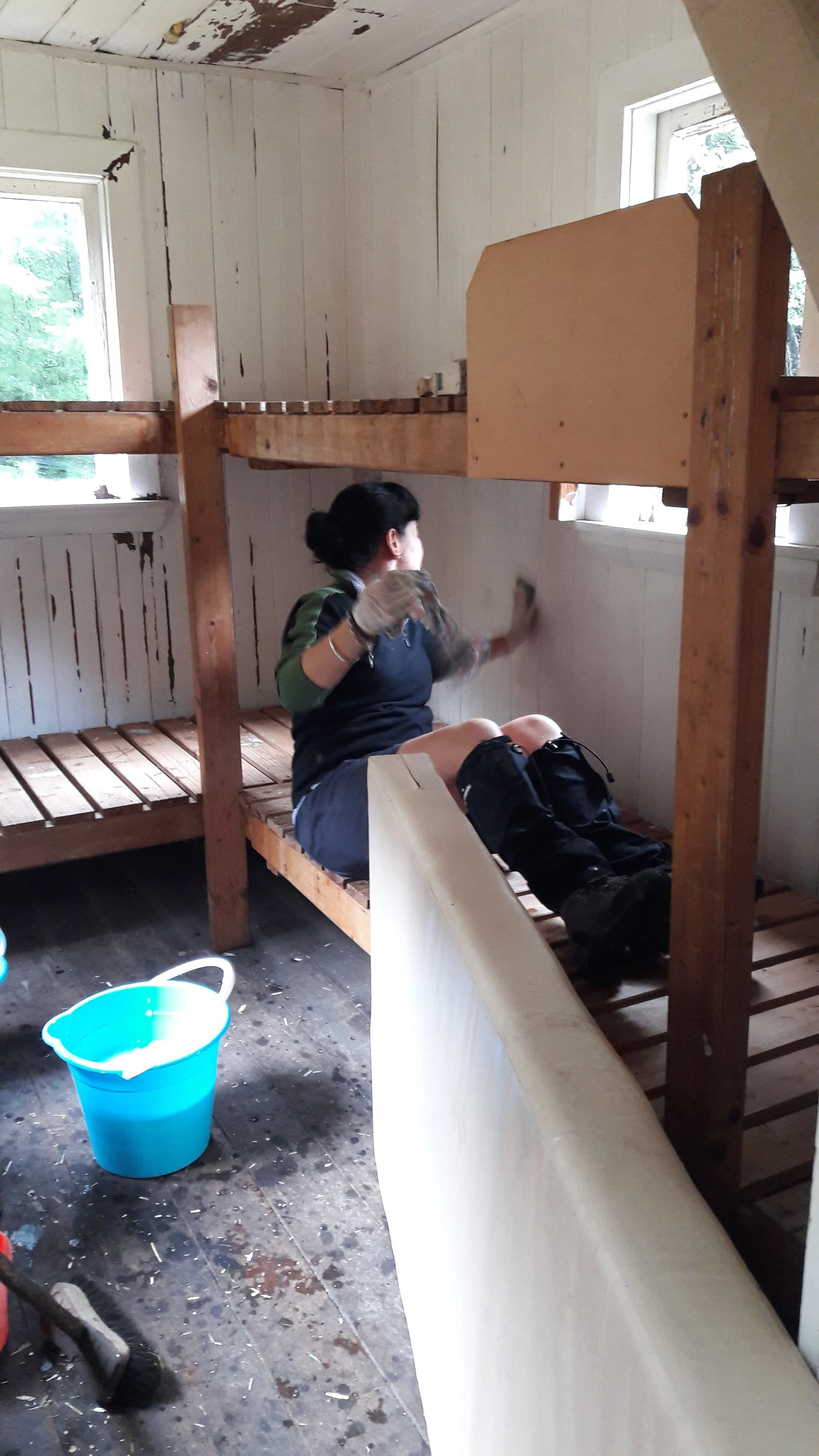 14 April - Tania scrubbing bunkroom walls.jpg