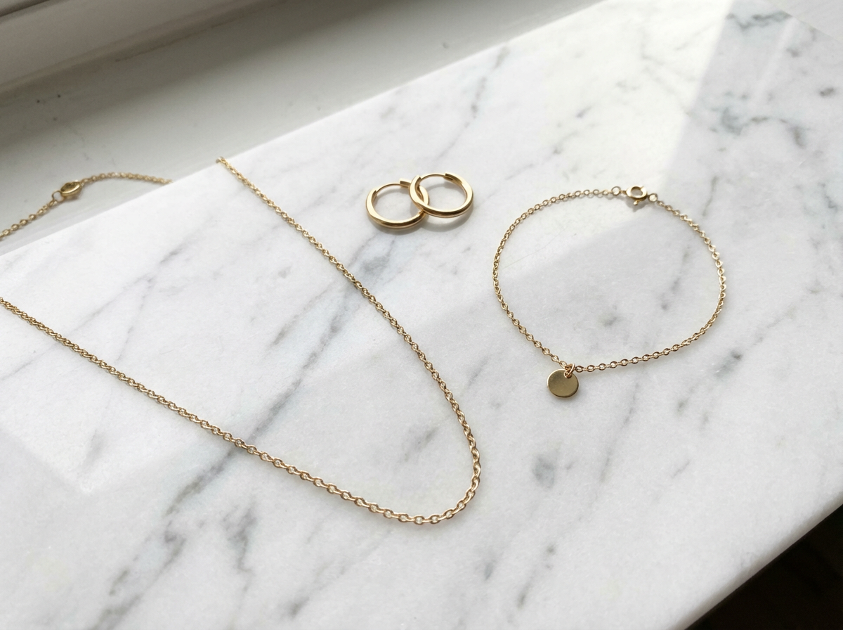 Minimalist jewelry essentials simple gold necklace earrings and bracelet