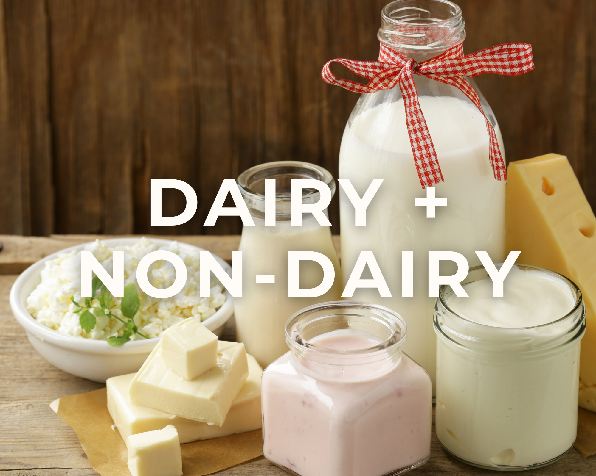 Assorted dairy products including milk, cheese, yogurt, and cottage cheese arranged on a rustic wooden surface with a wooden background.