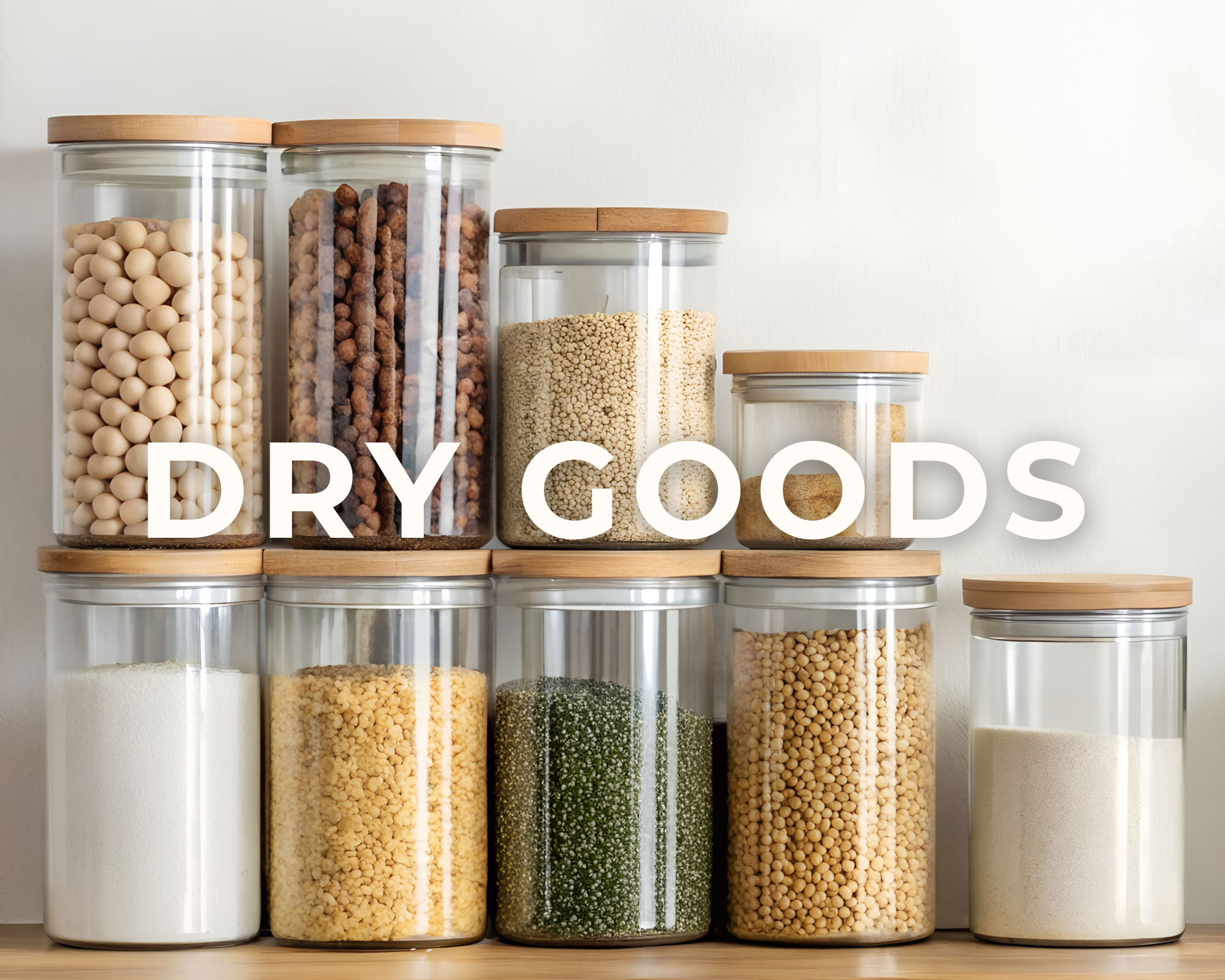 A collection of glass jars filled with various dry goods such as rice, beans, lentils, and grains, arranged on a wooden shelf against a light background, with the text "DRY GOODS" overlaid.