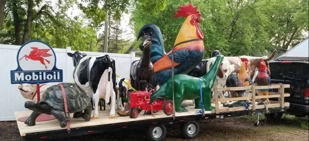 recycled cast aluminum animal sculptures on truck trailer